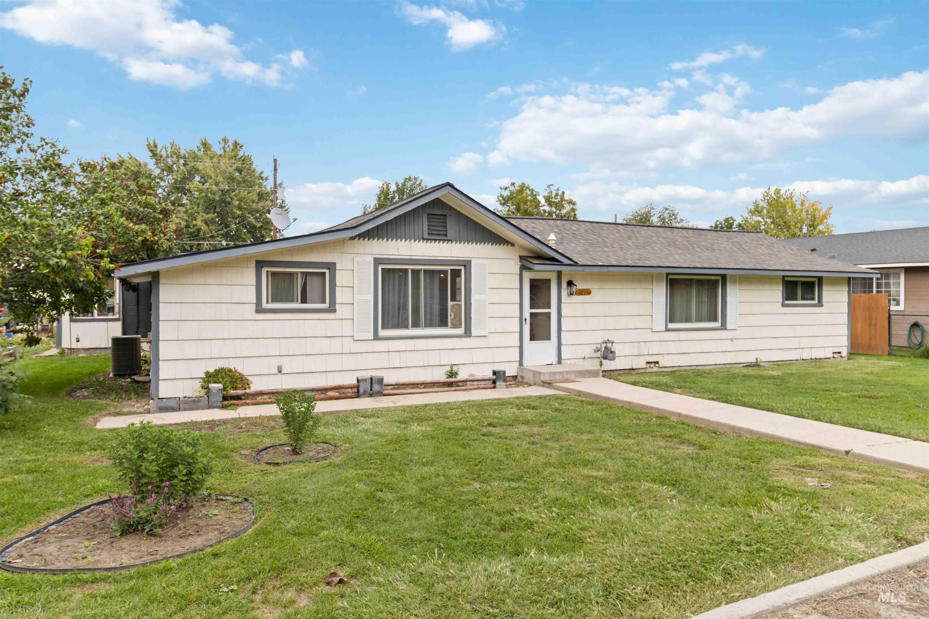 Single story home featuring a front yard
