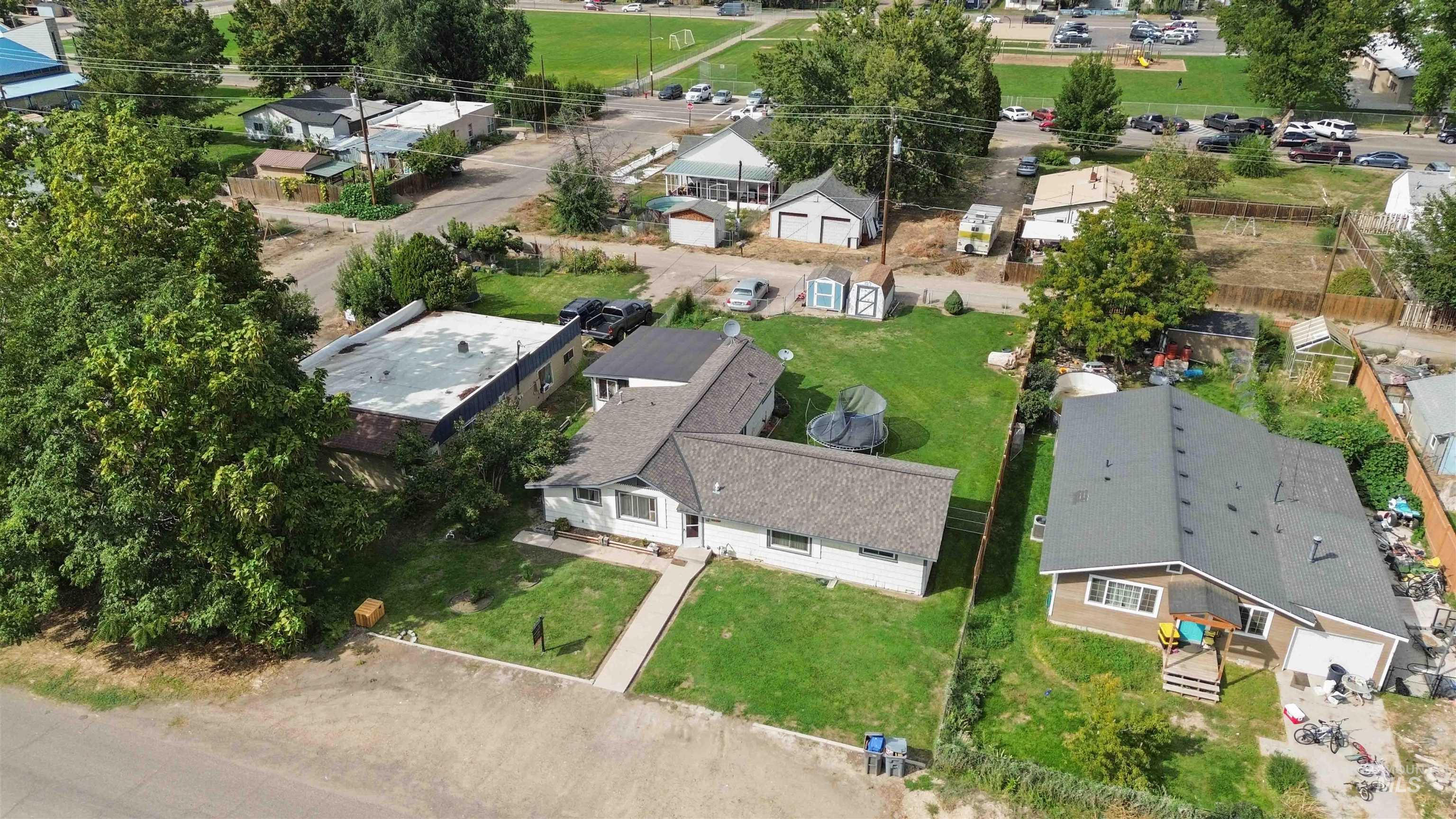 Aerial overview of property's location with nearby suburban area