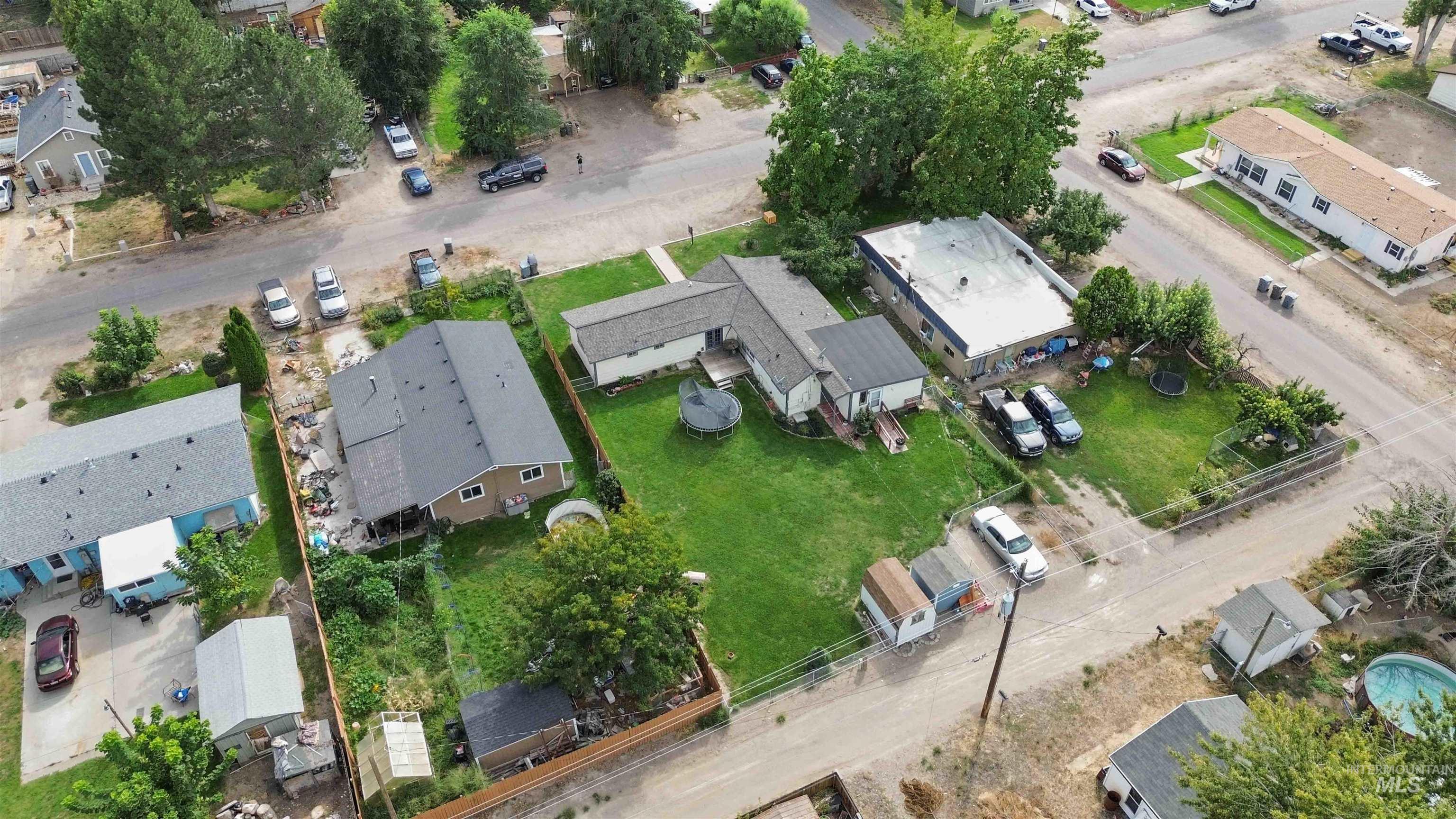 Aerial view of property's location featuring nearby suburban area