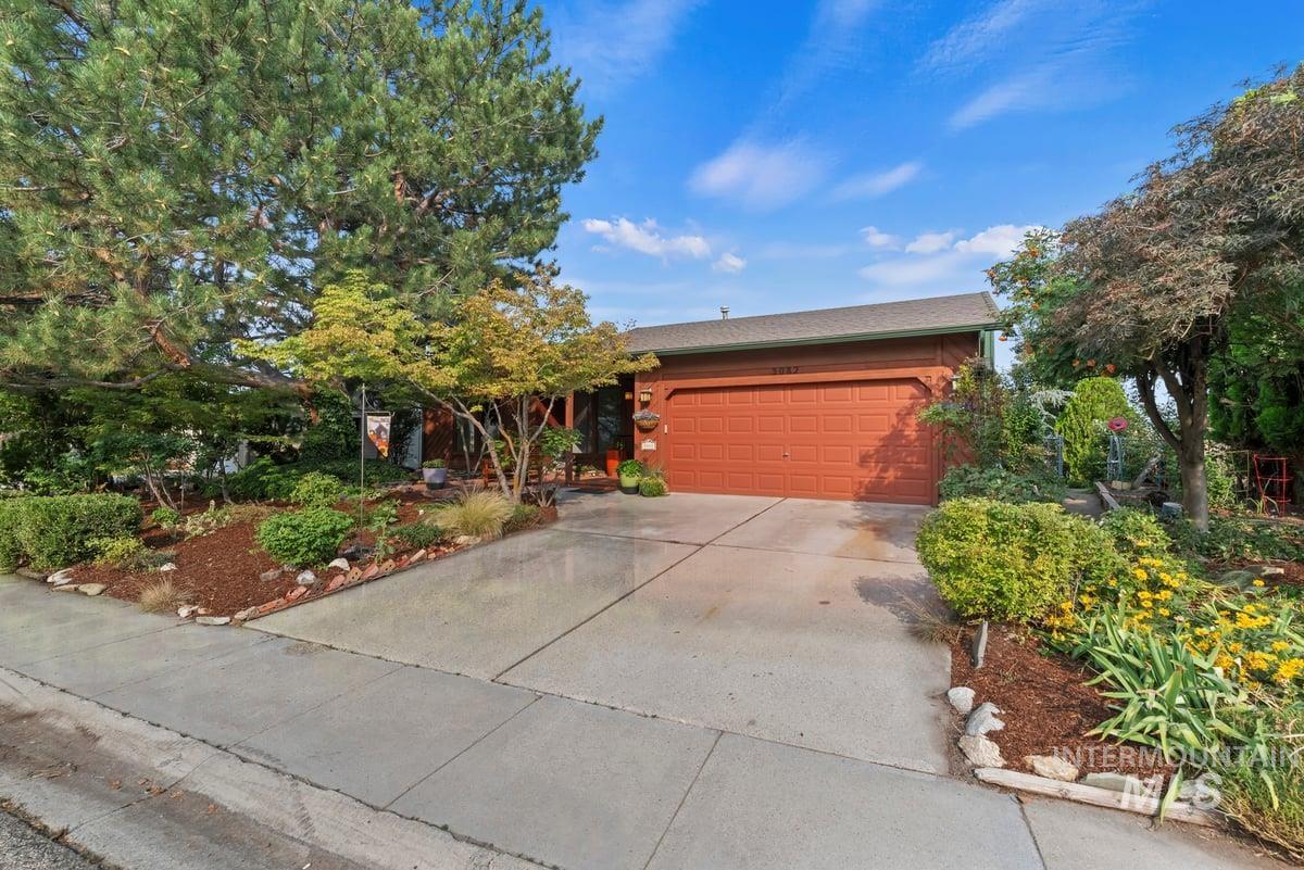 View of front of property featuring driveway and an attached garage