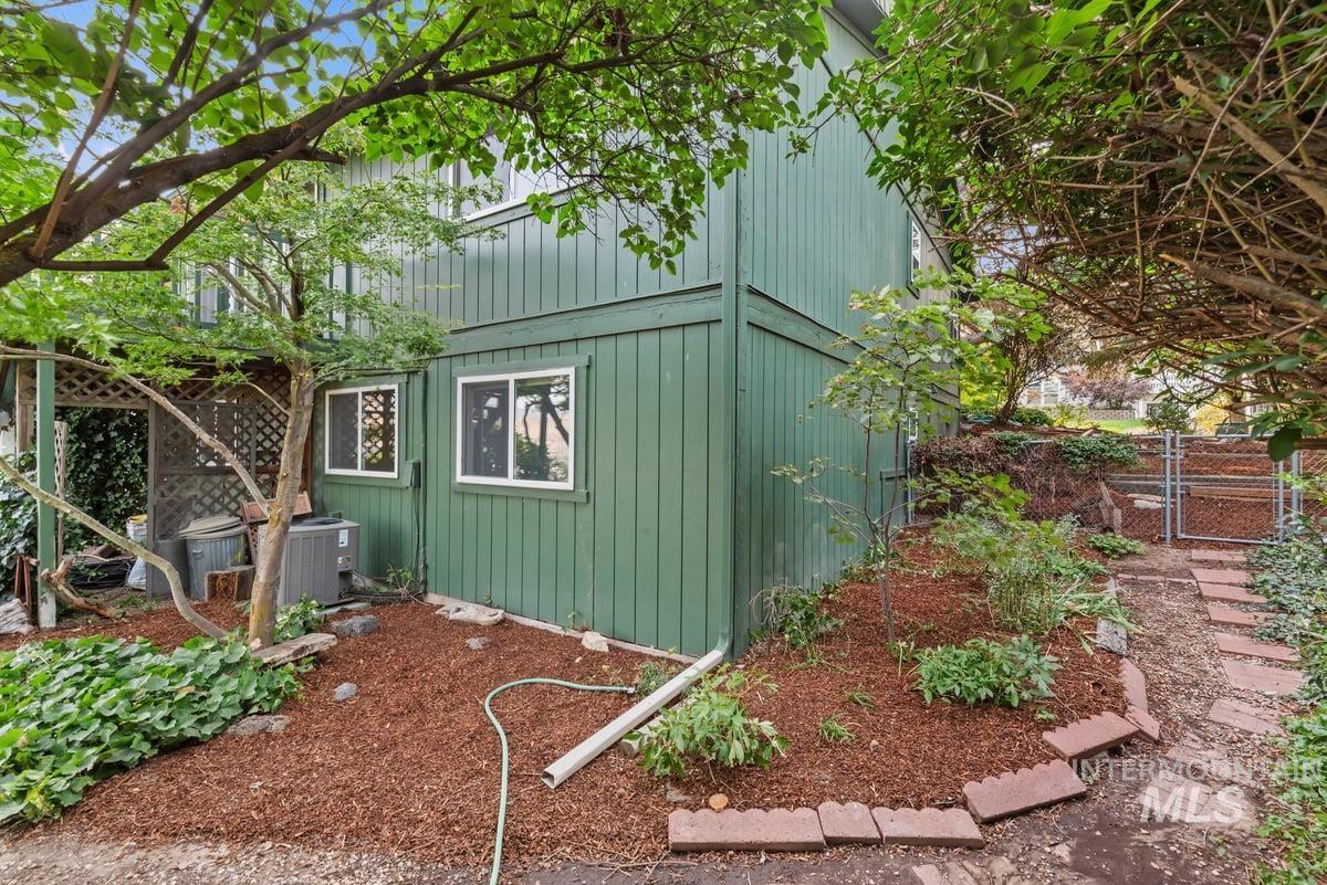 View of outbuilding featuring a gate