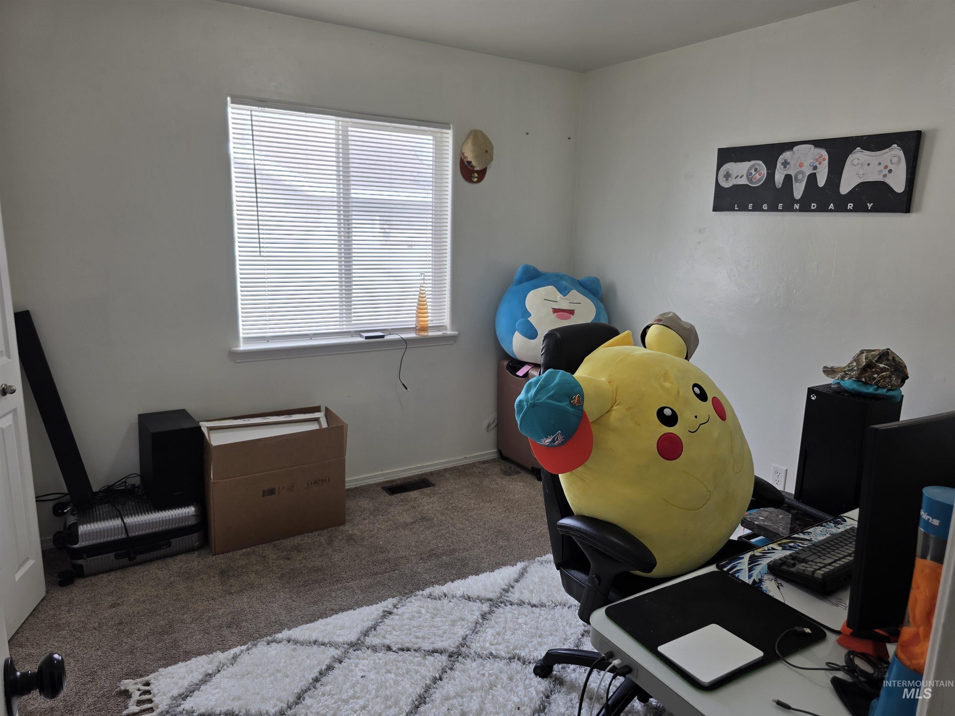 Carpeted office with baseboards
