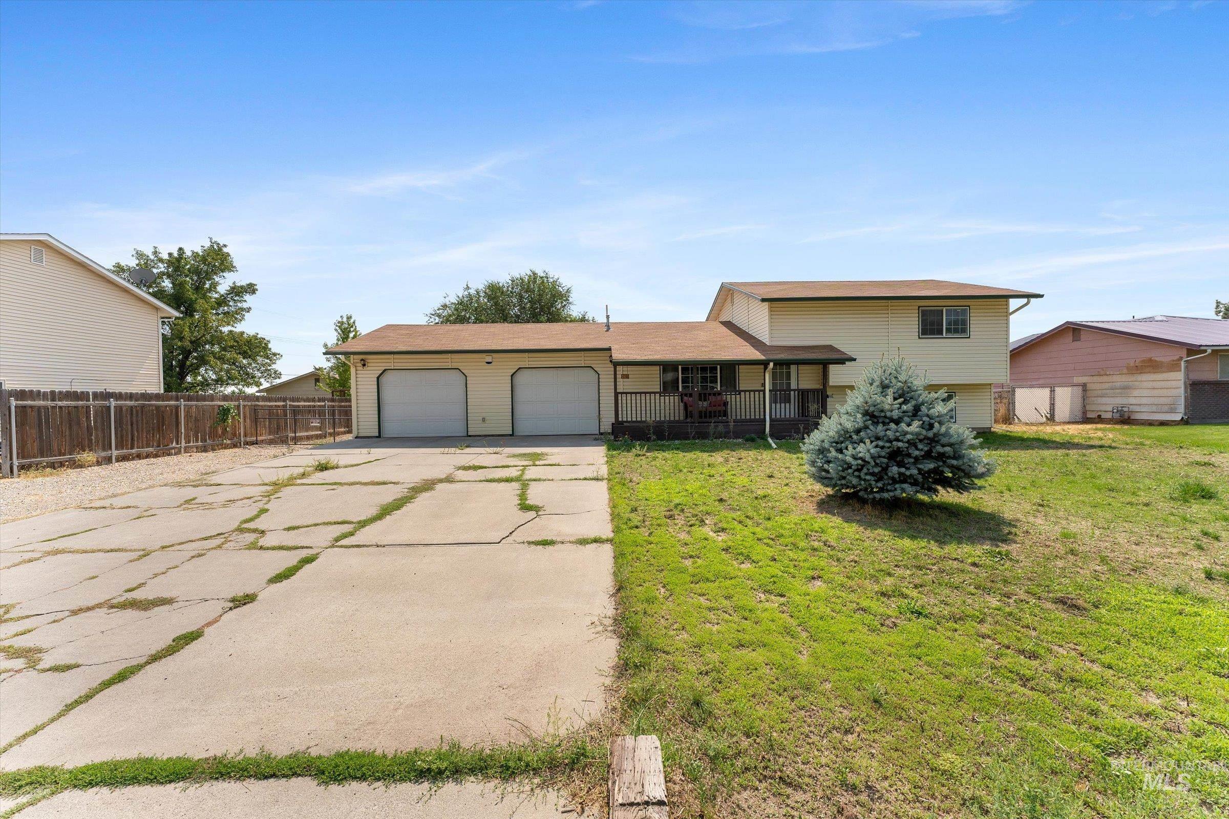 Tri-level home with driveway and a garage