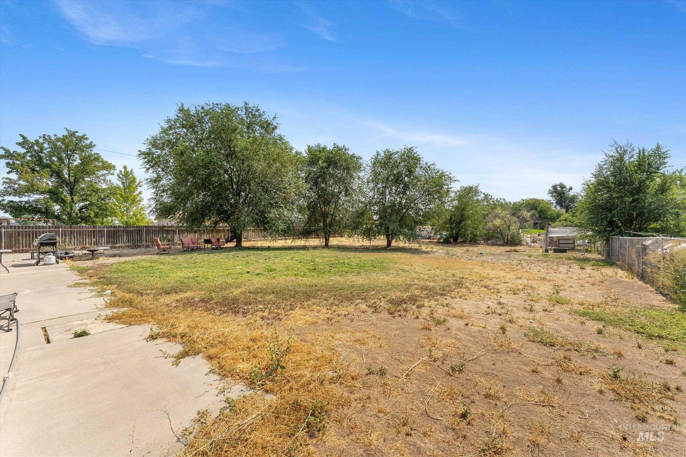View of fenced backyard