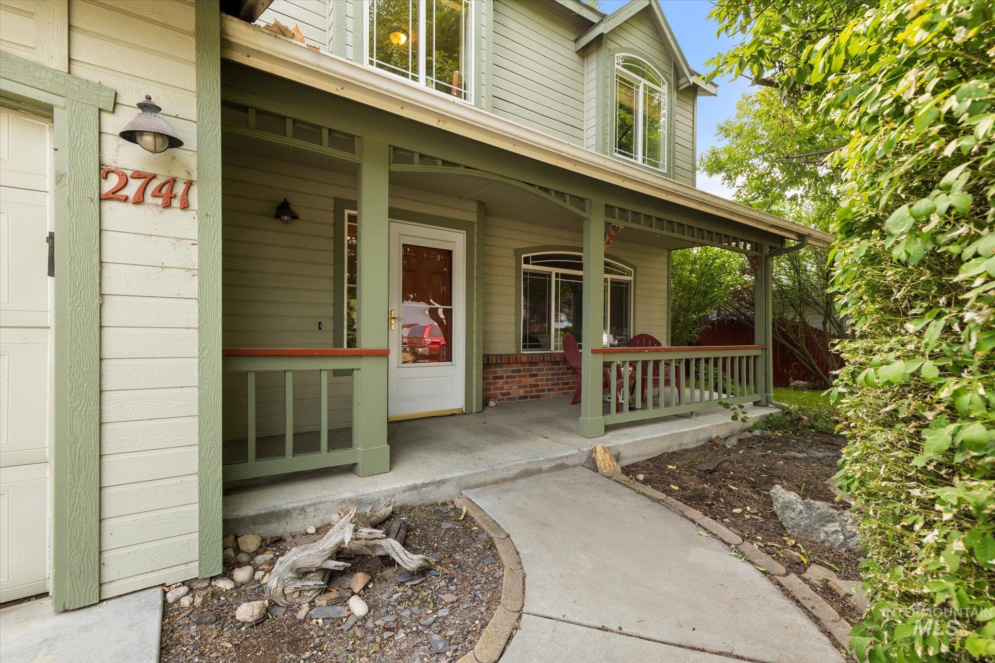 Doorway to property with covered porch