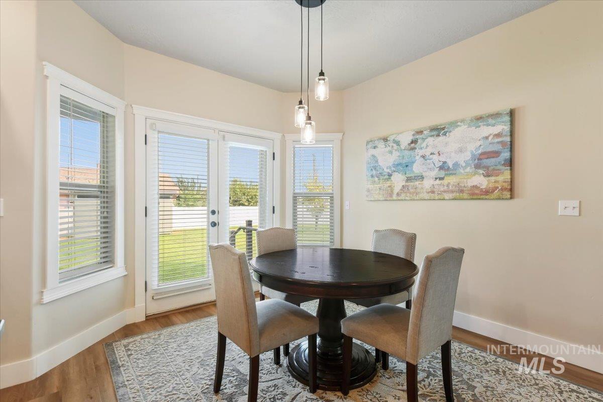 Dining room with wood finished floors and french doors