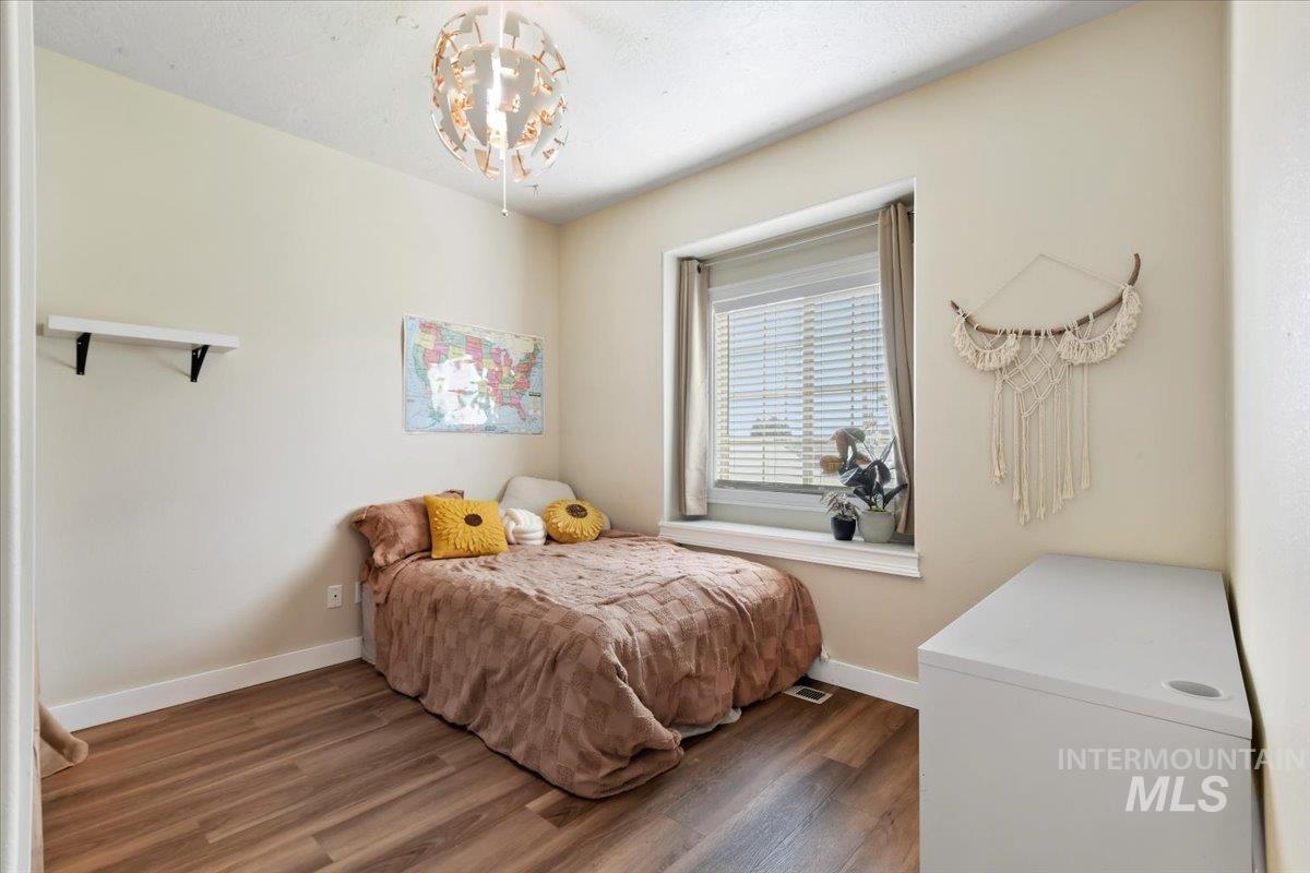 Bedroom with dark wood finished floors