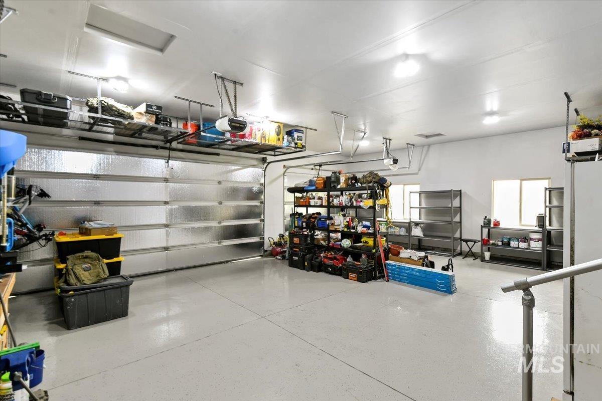 Garage featuring a garage door opener
