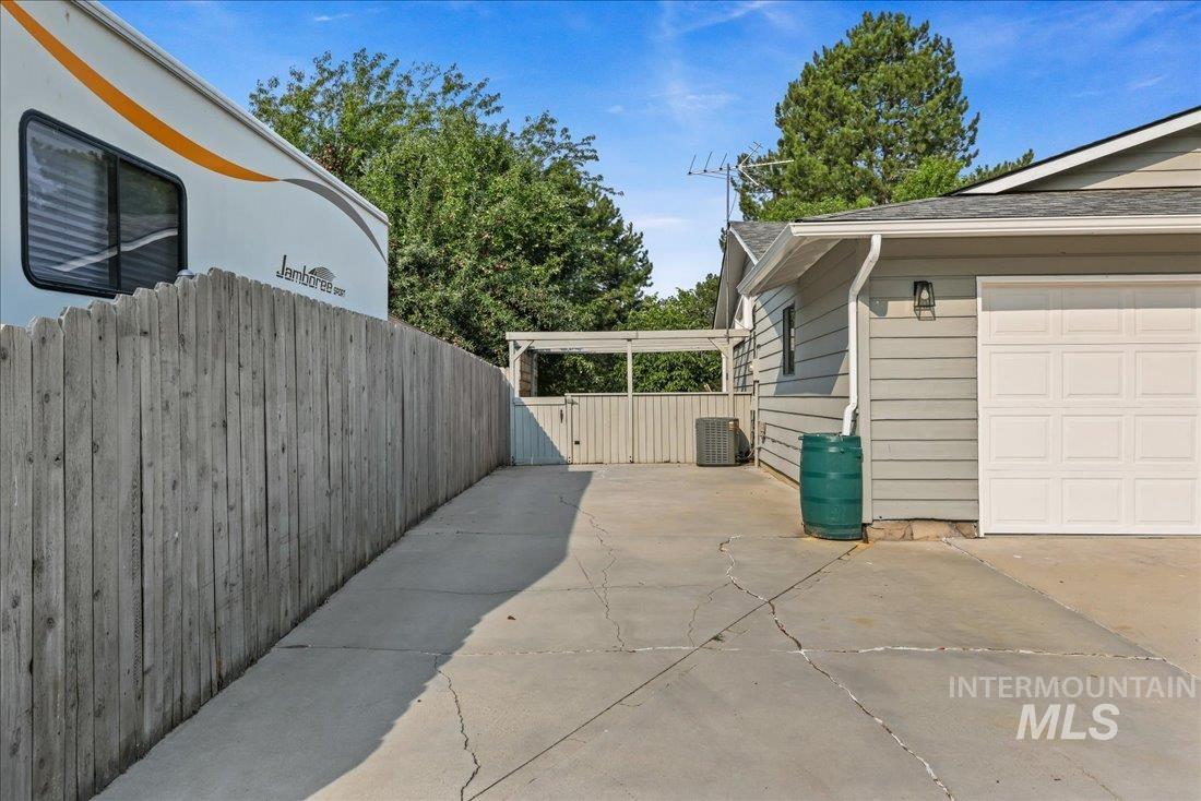 View of home's exterior with driveway and a garage