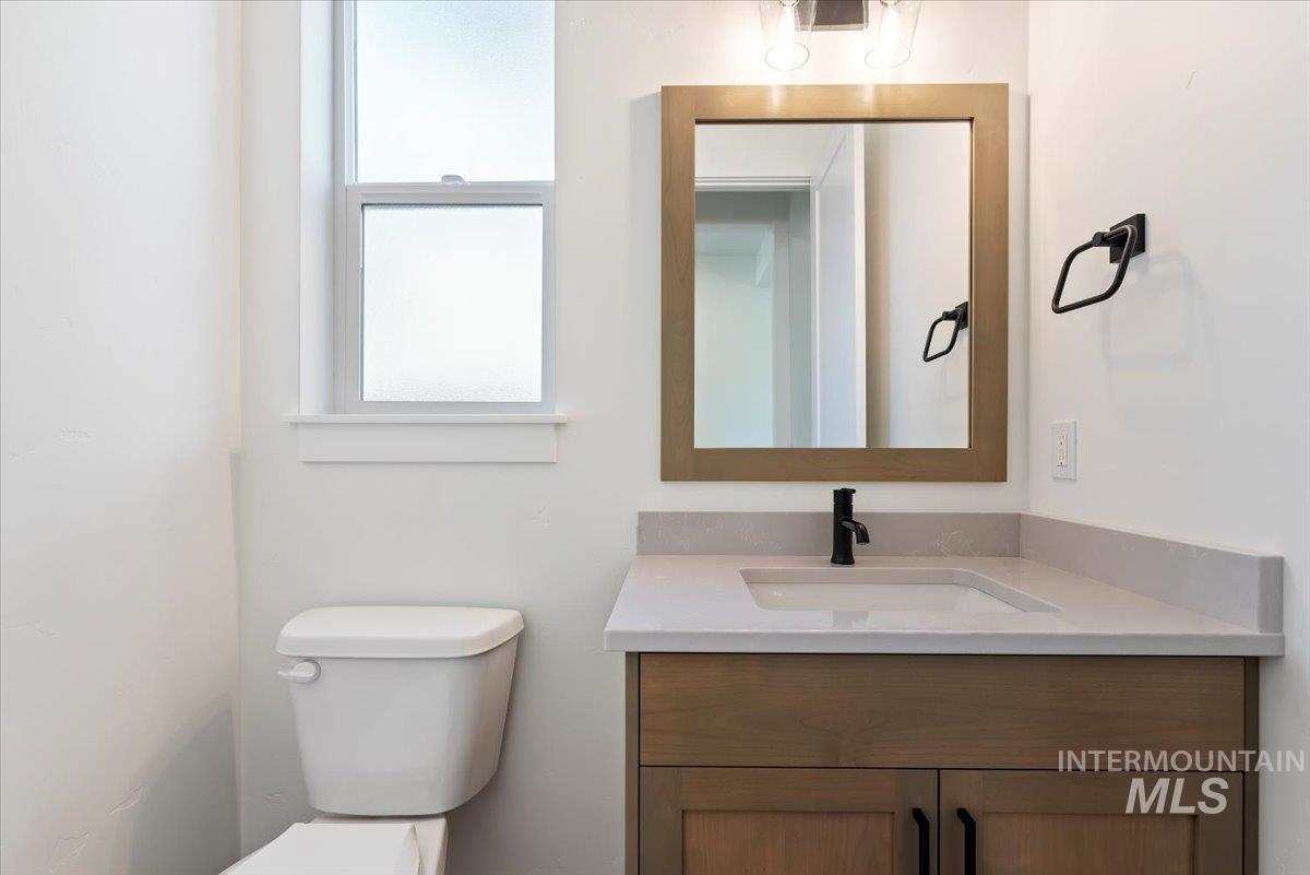 Bathroom featuring vanity and toilet