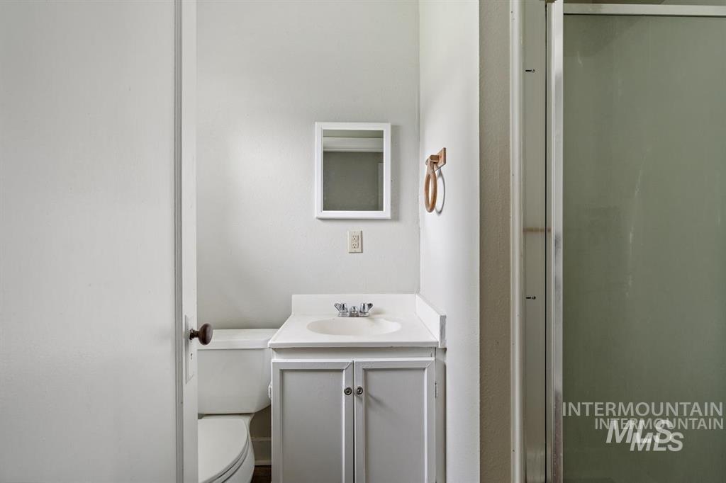 Bathroom with vanity and a stall shower