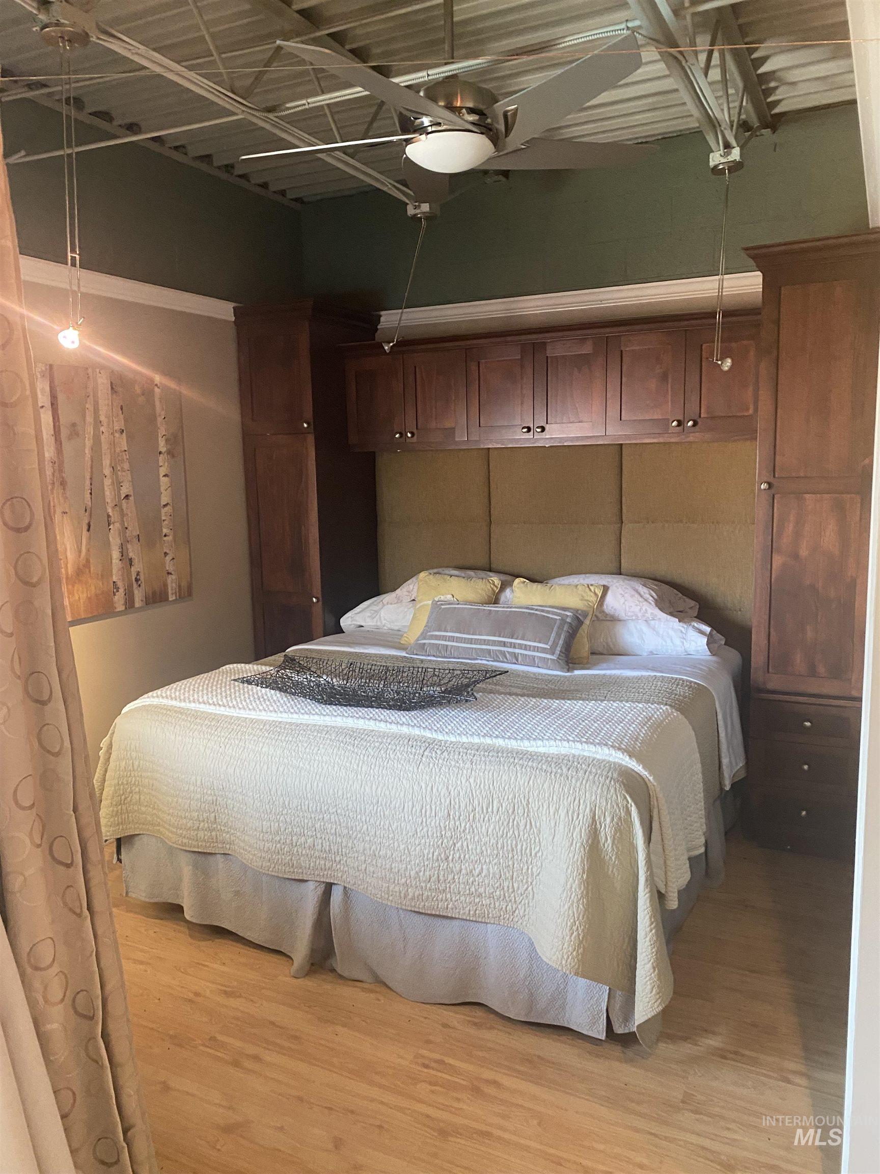 Bedroom featuring trac lighting.  Could be den/office/study area.