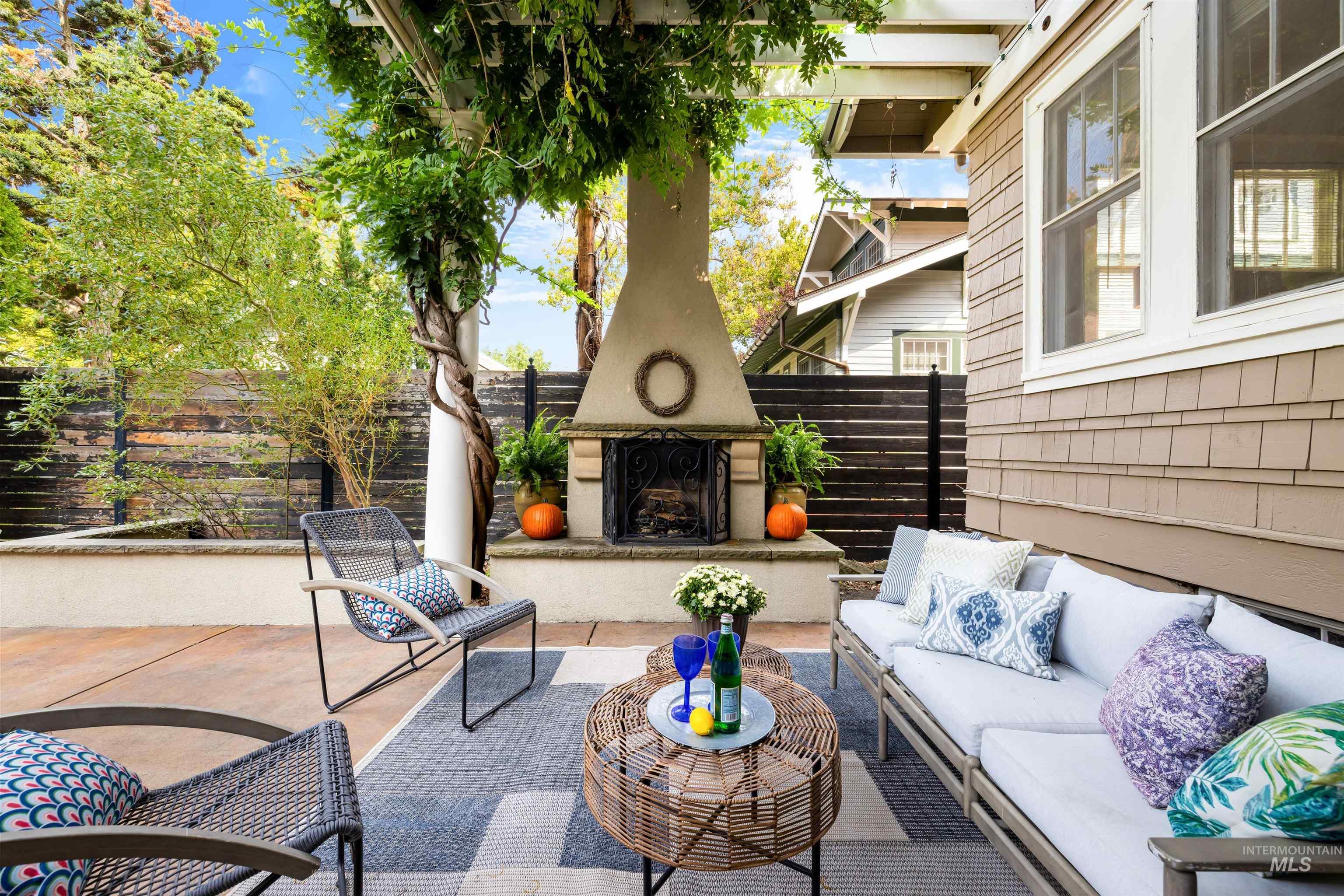 View of patio / terrace with an outdoor living space with a fireplace