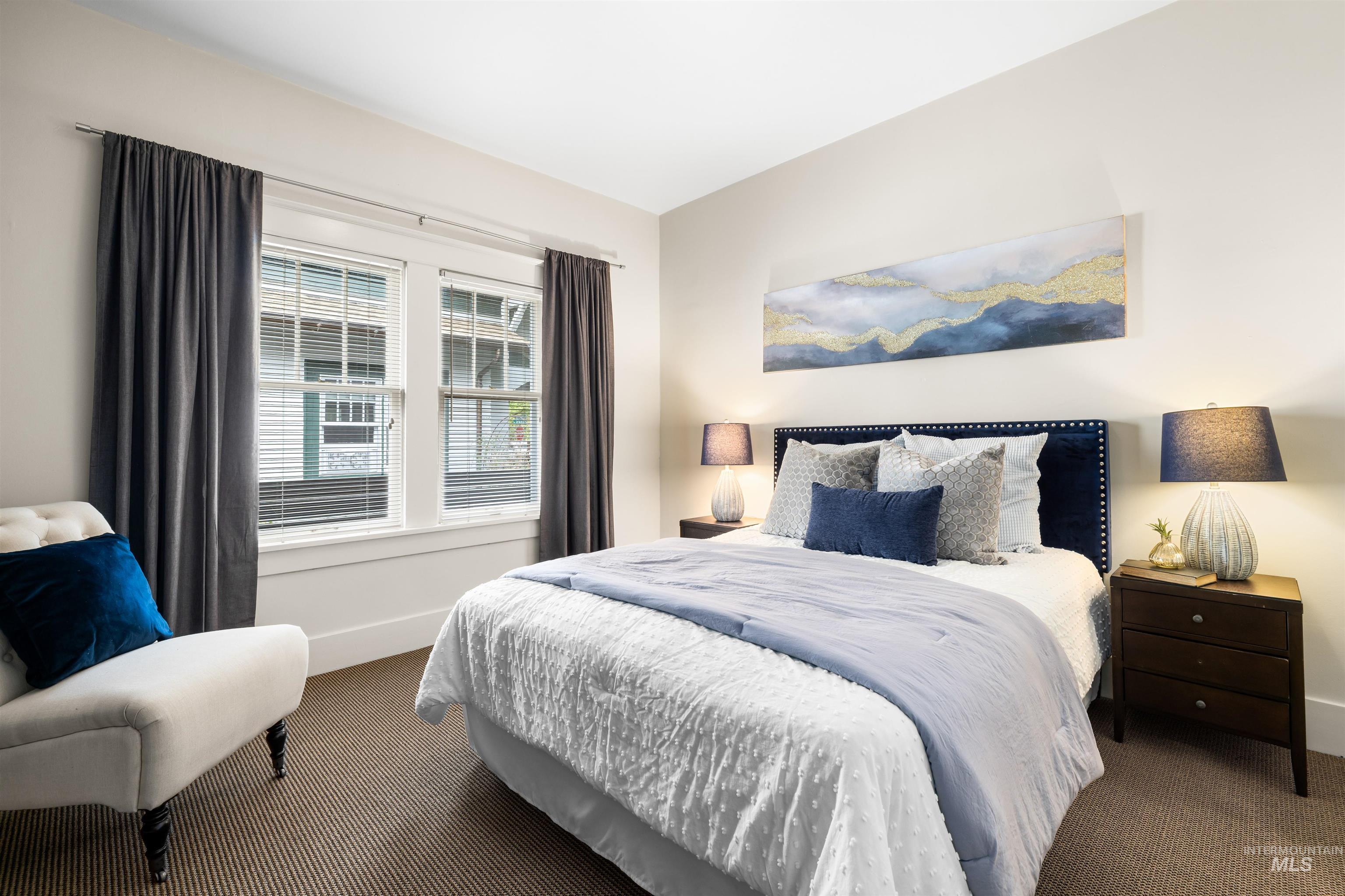 Bedroom with carpet flooring and baseboards