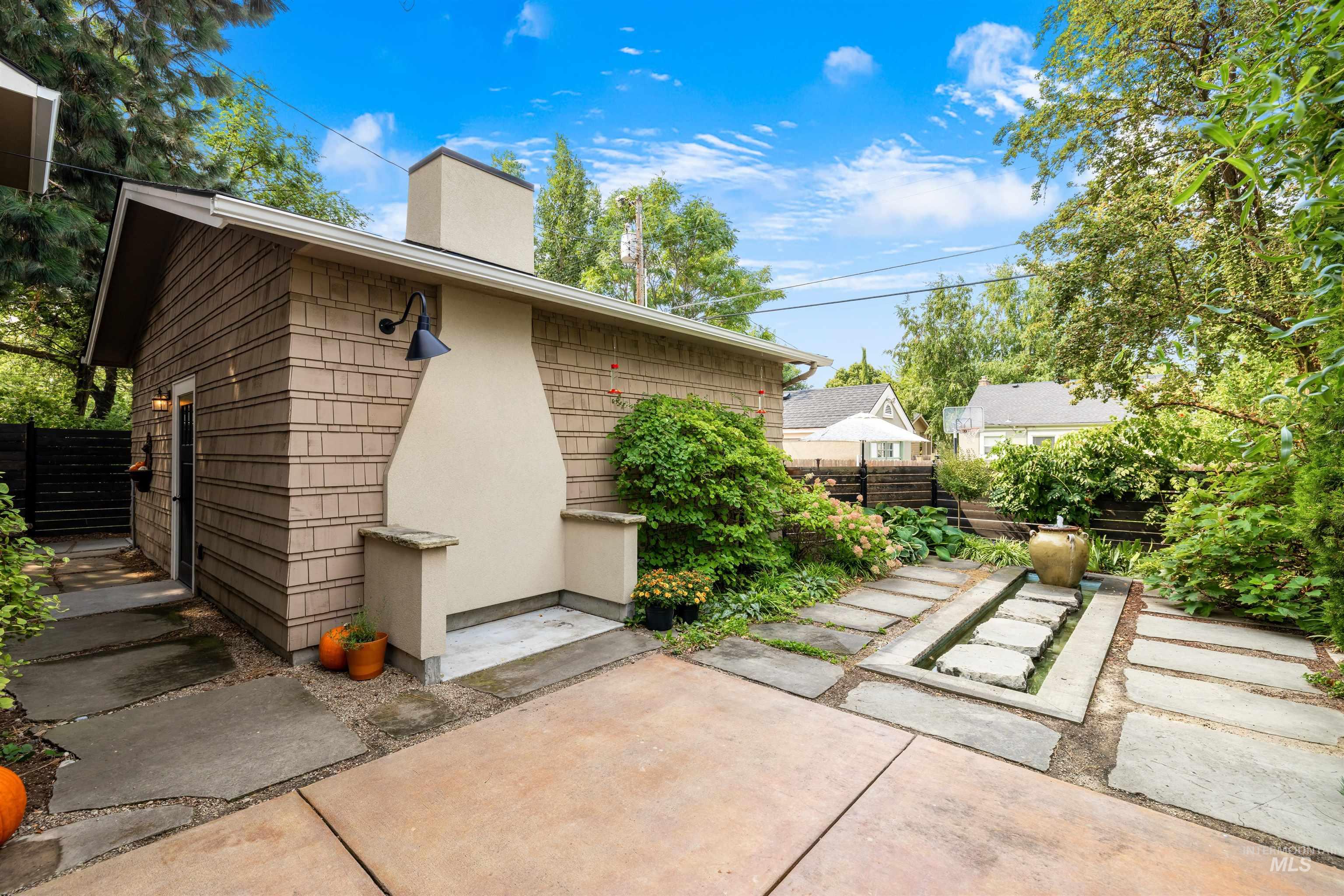 Rear view of property with a chimney