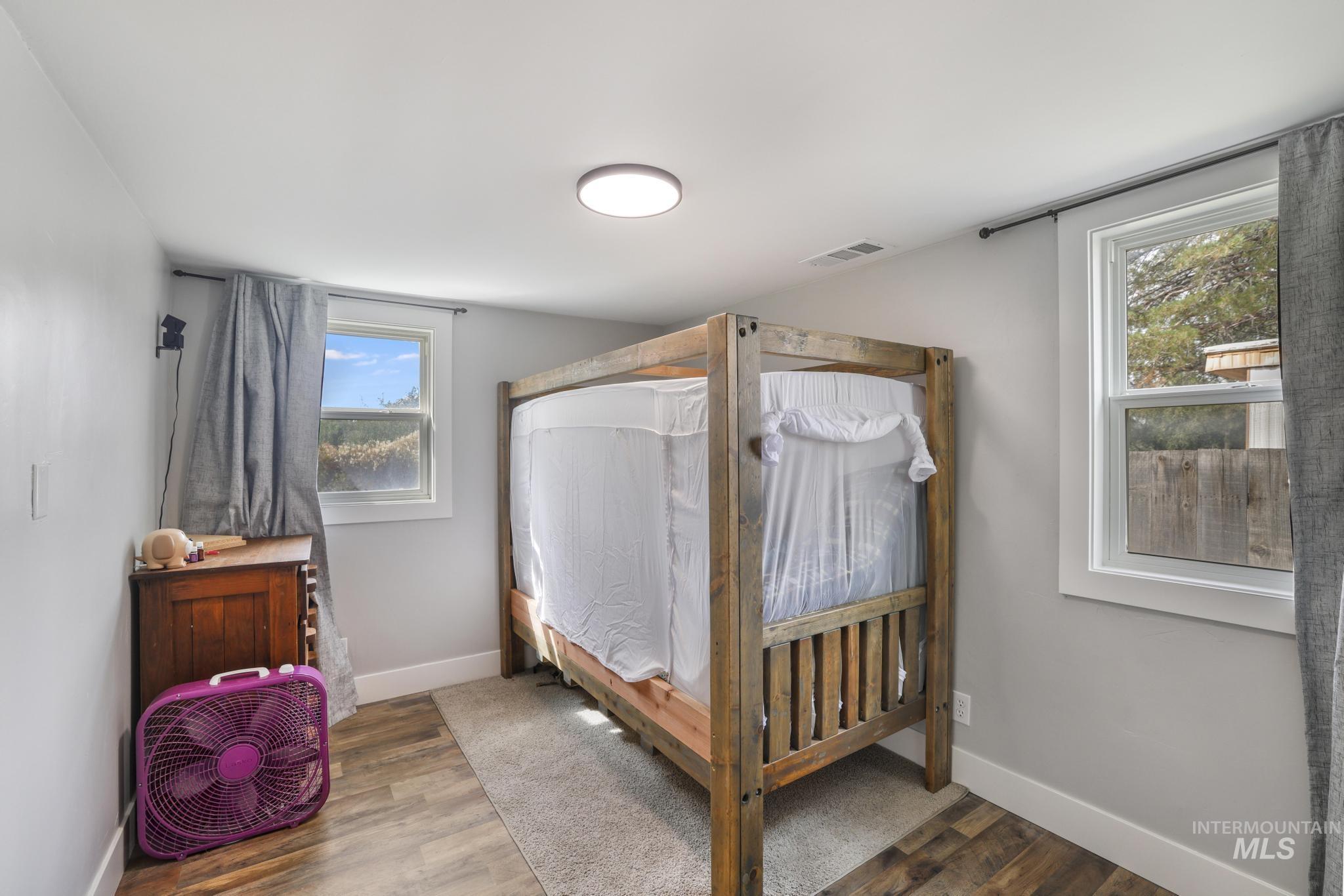 Bedroom with wood finished floors