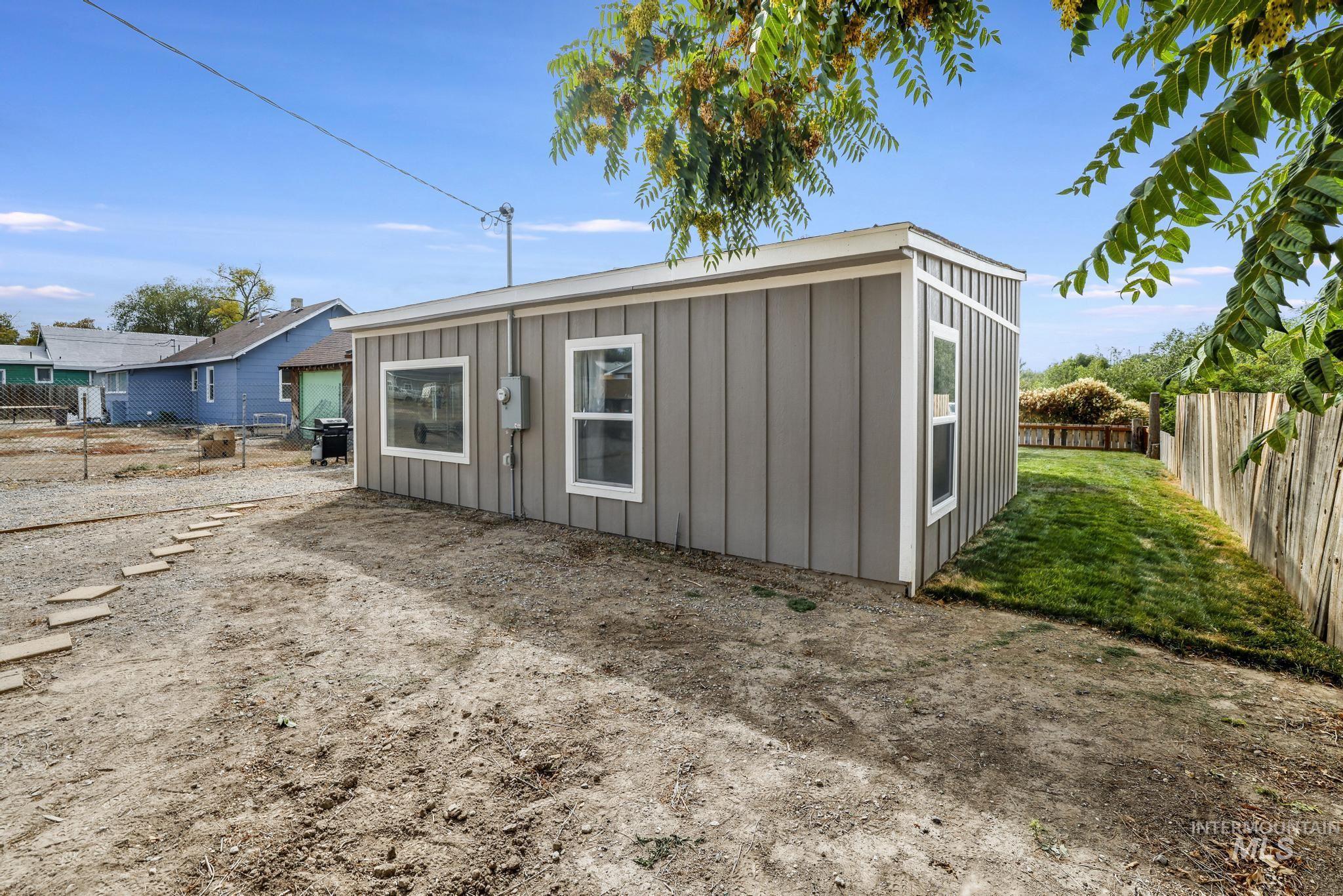 View of outdoor structure featuring a fenced backyard