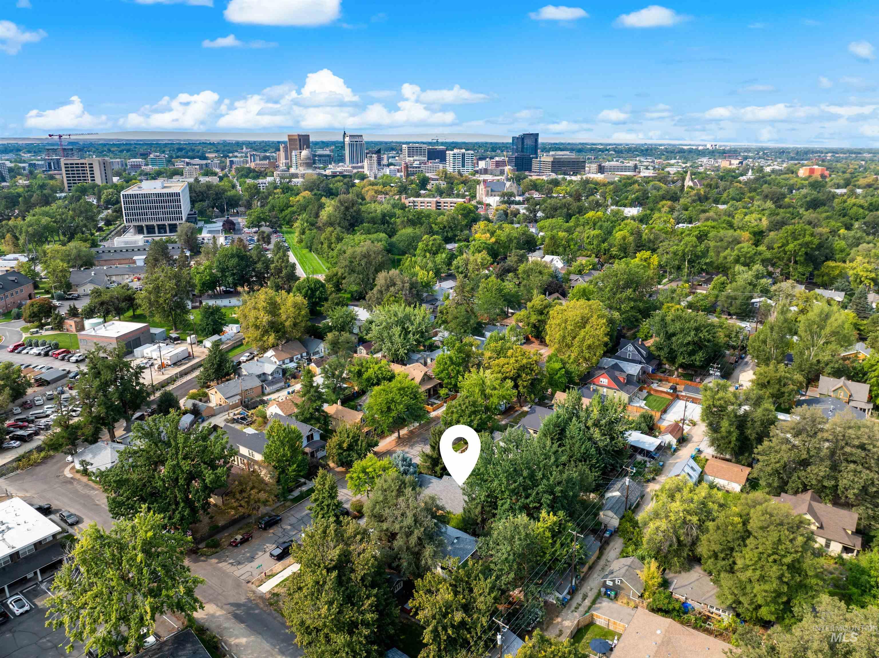 Aerial view of property's location with nearby urban area