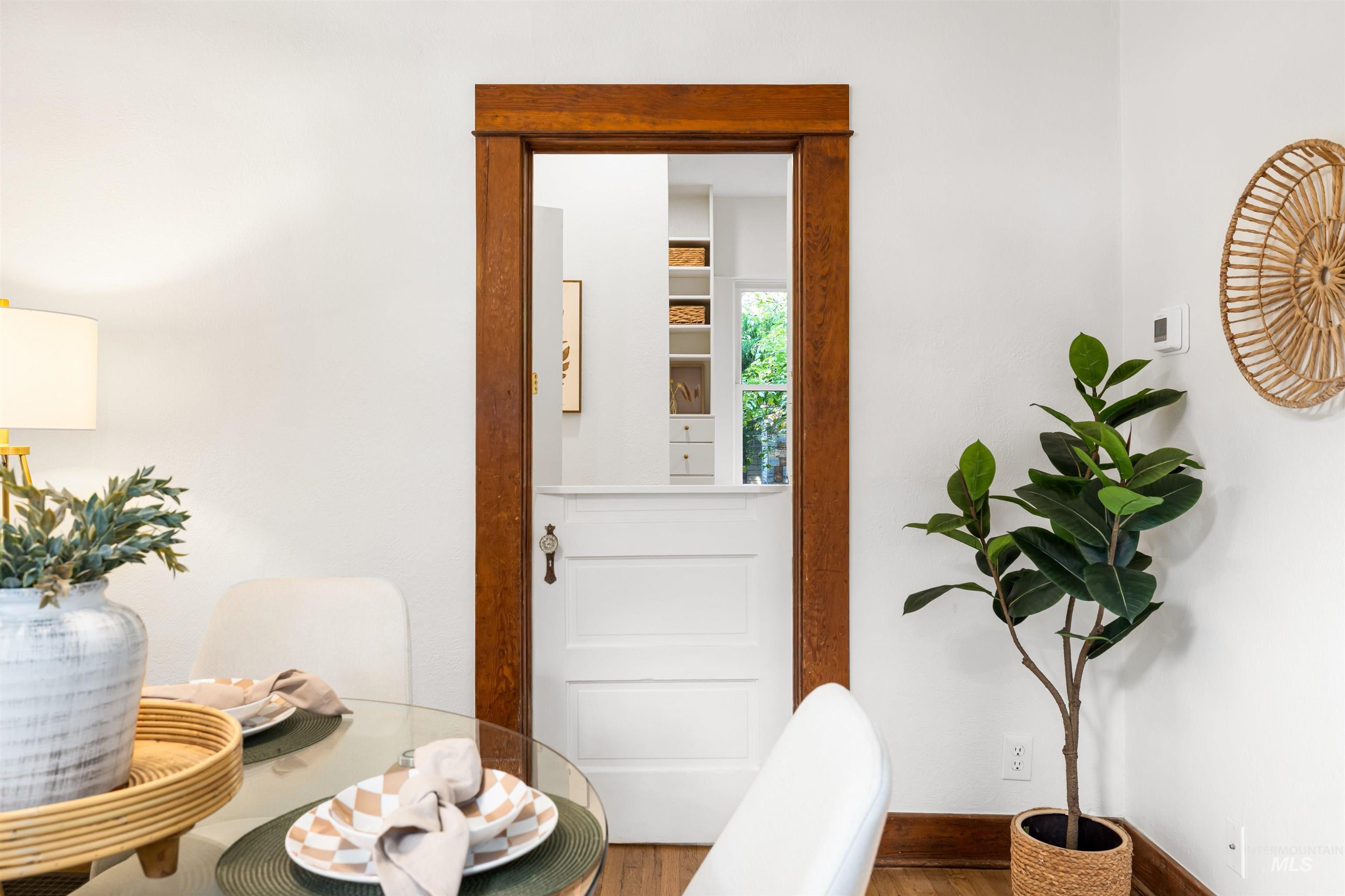 Dining room featuring wood finished floors and baseboards
