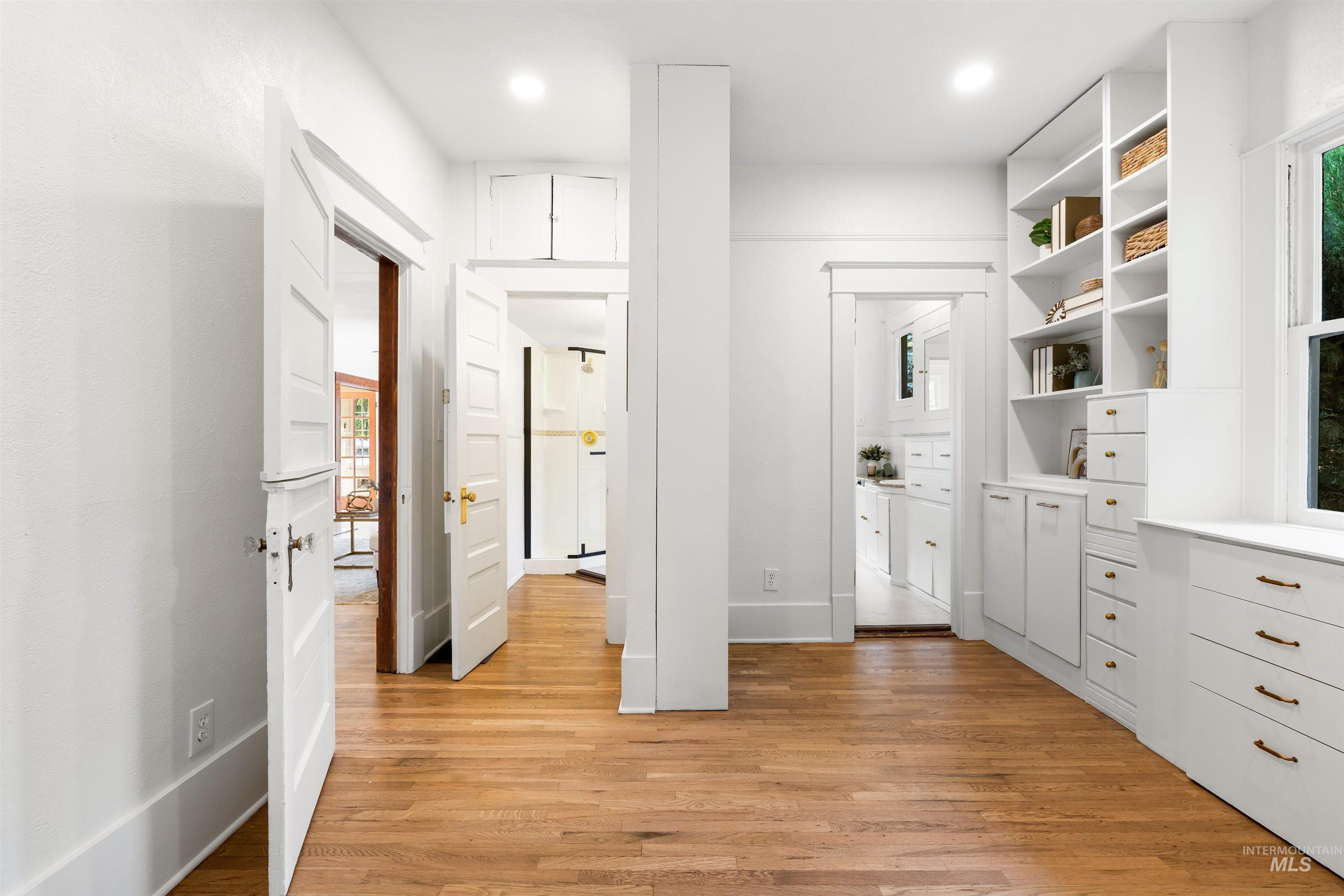Walk in closet featuring light wood-style flooring