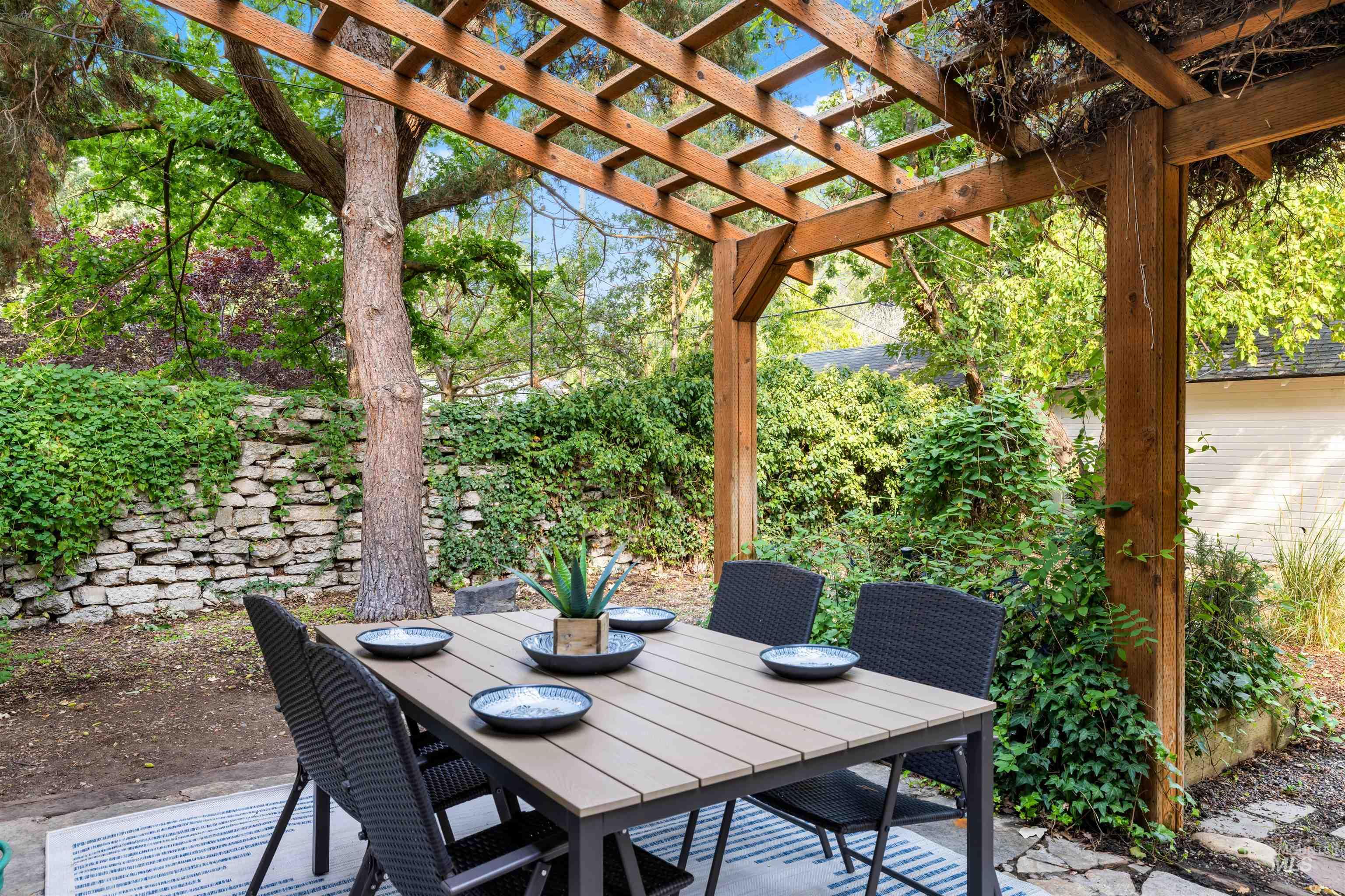 View of patio / terrace with outdoor dining space and a pergola