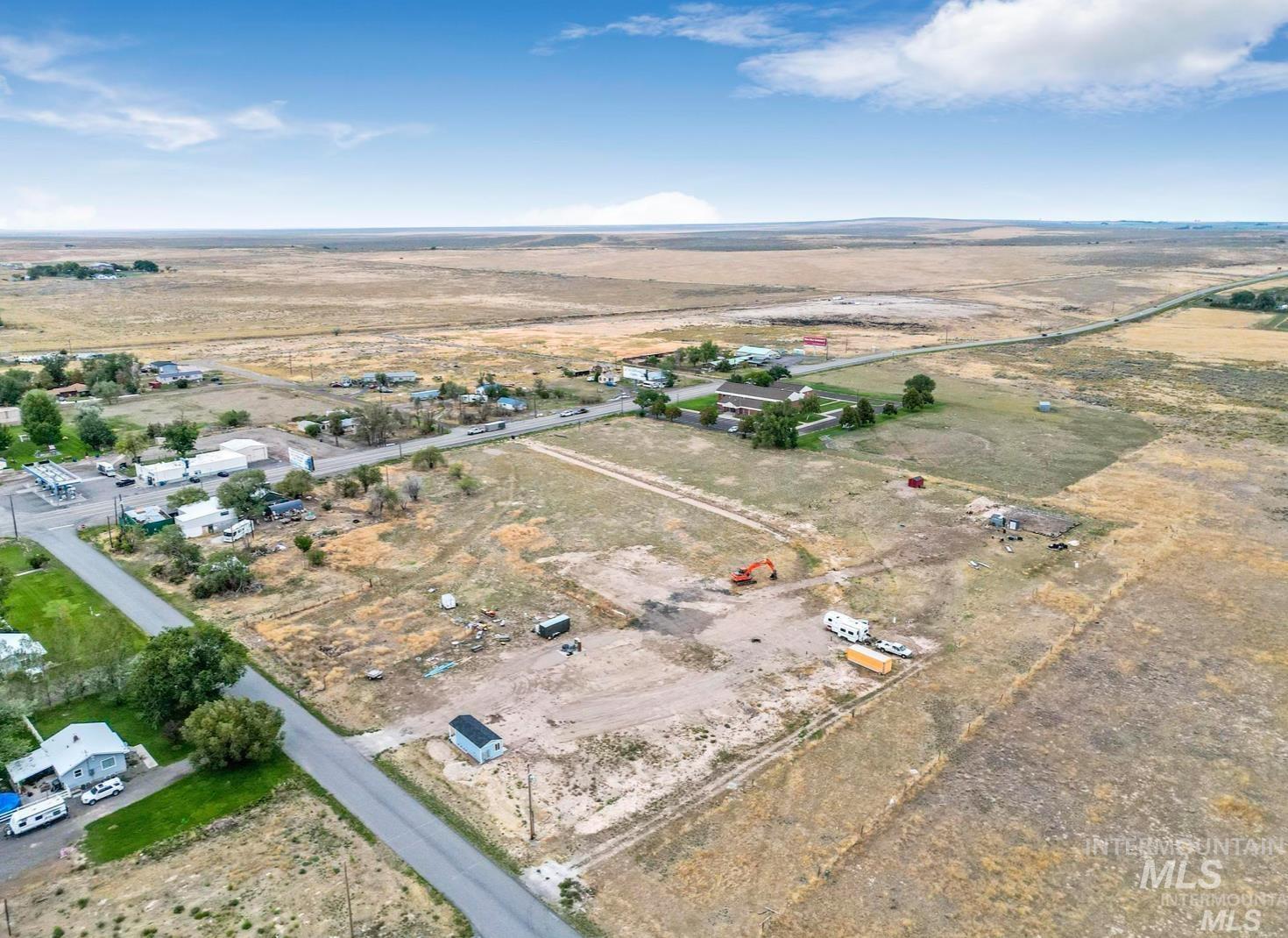 Aerial view of property and surrounding area with rural landscape