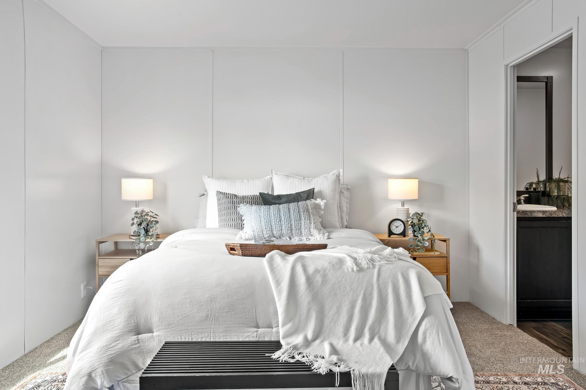 Bedroom featuring carpet and connected bathroom