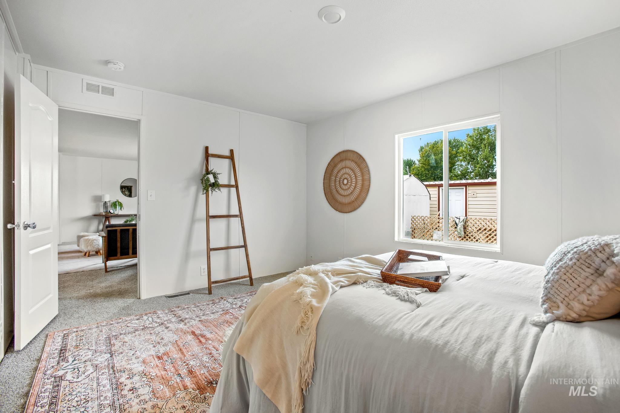 Carpeted bedroom with baseboards