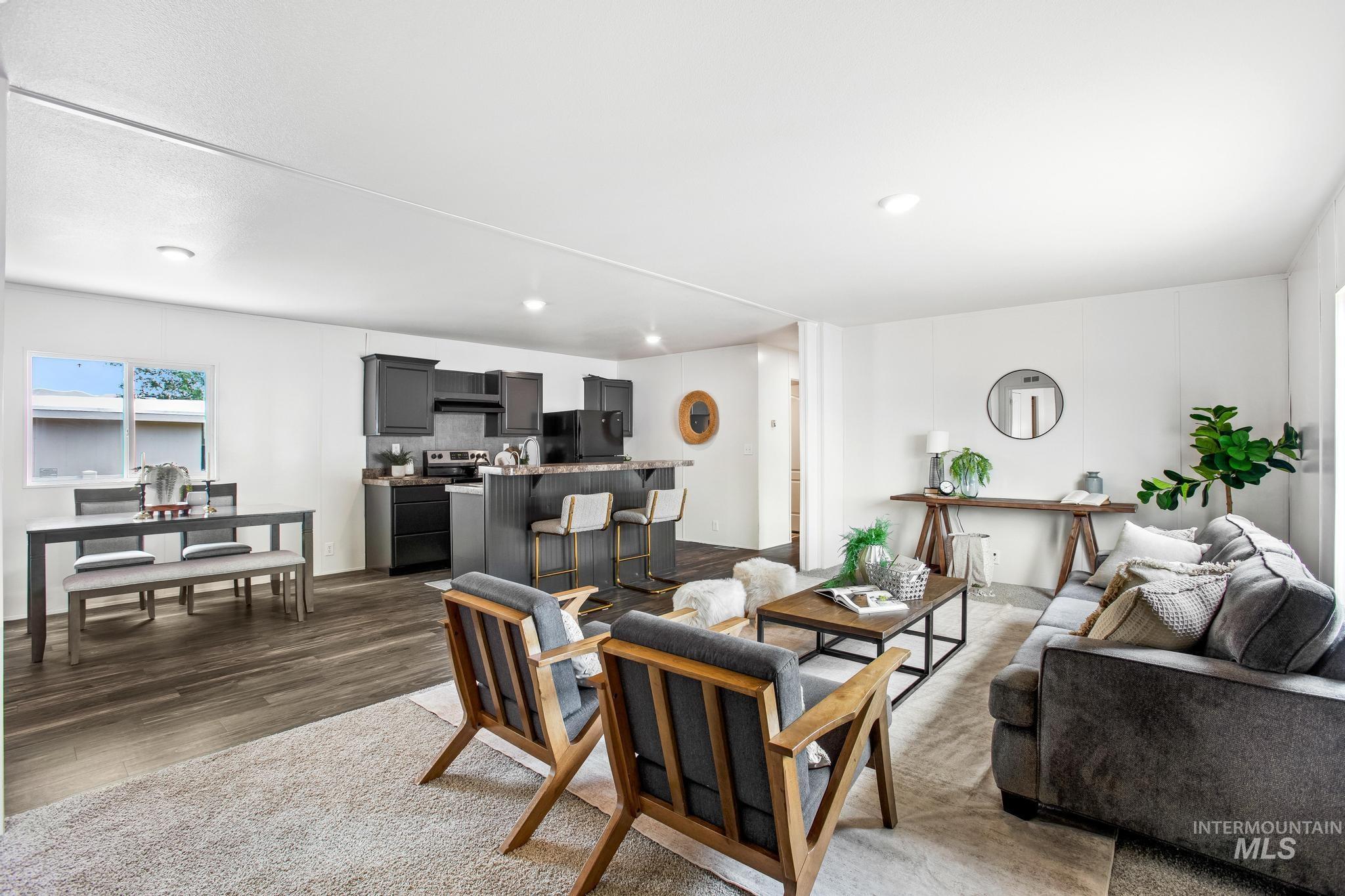 Living room with wood finished floors and recessed lighting