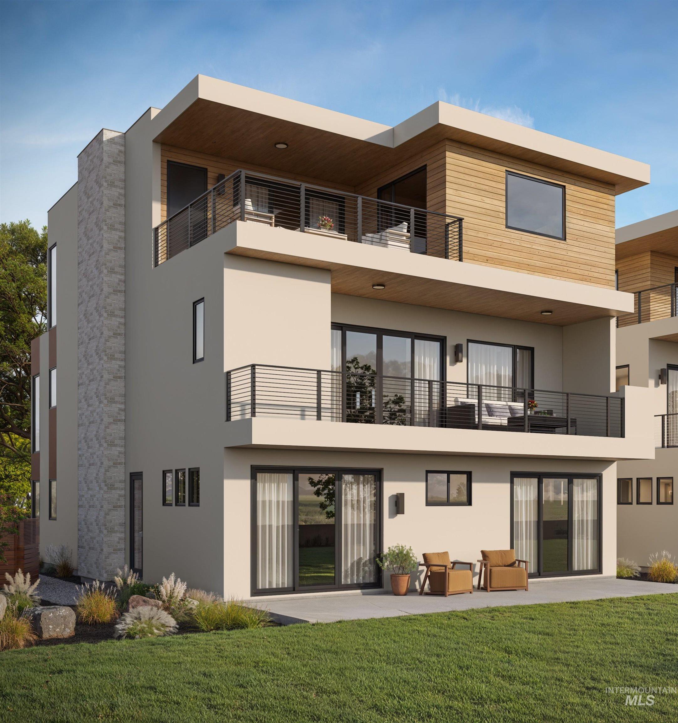 Rear view of property with a balcony, a yard, stucco siding, and a patio