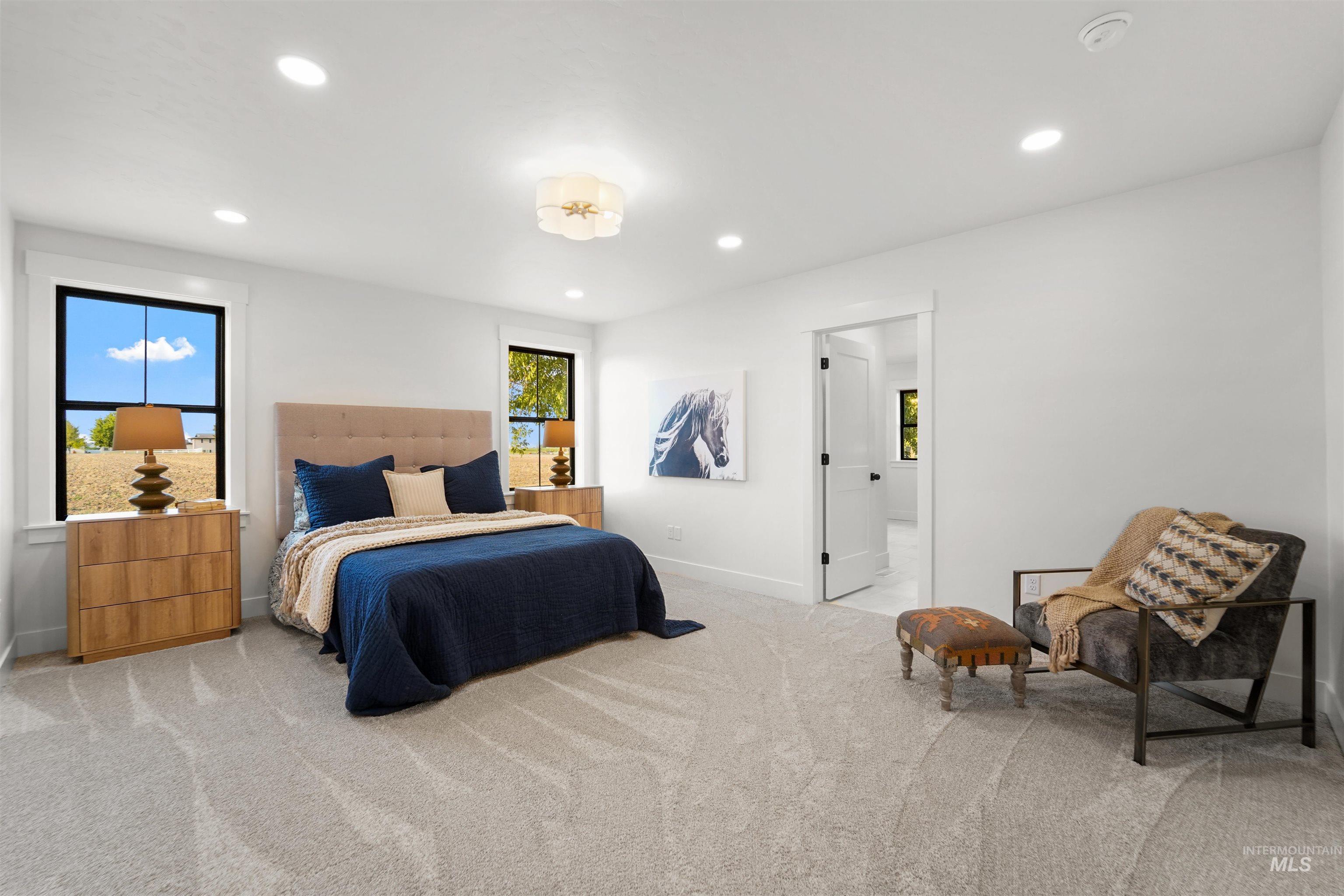 Carpeted bedroom with recessed lighting
