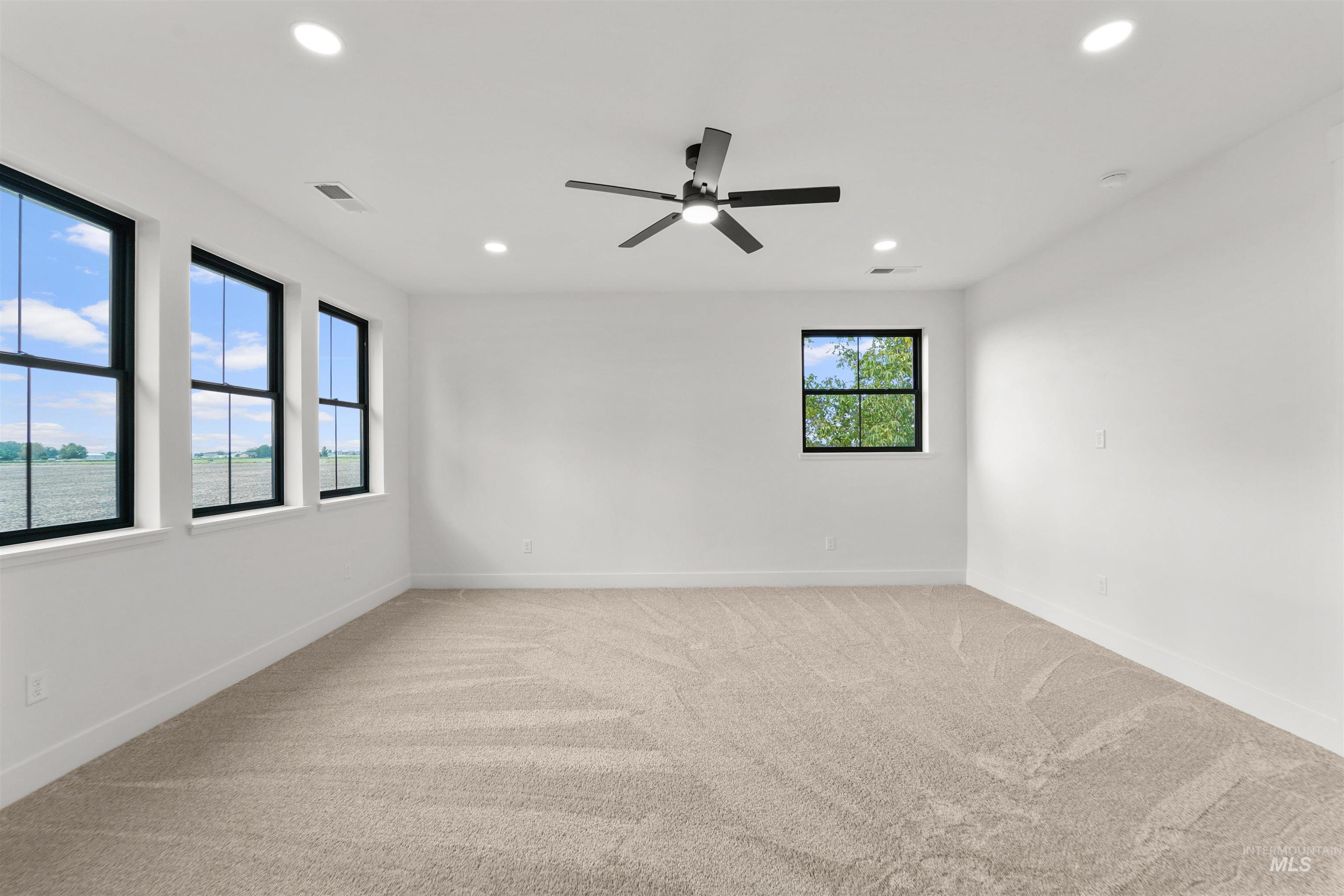 Unfurnished room with light carpet, recessed lighting, and ceiling fan