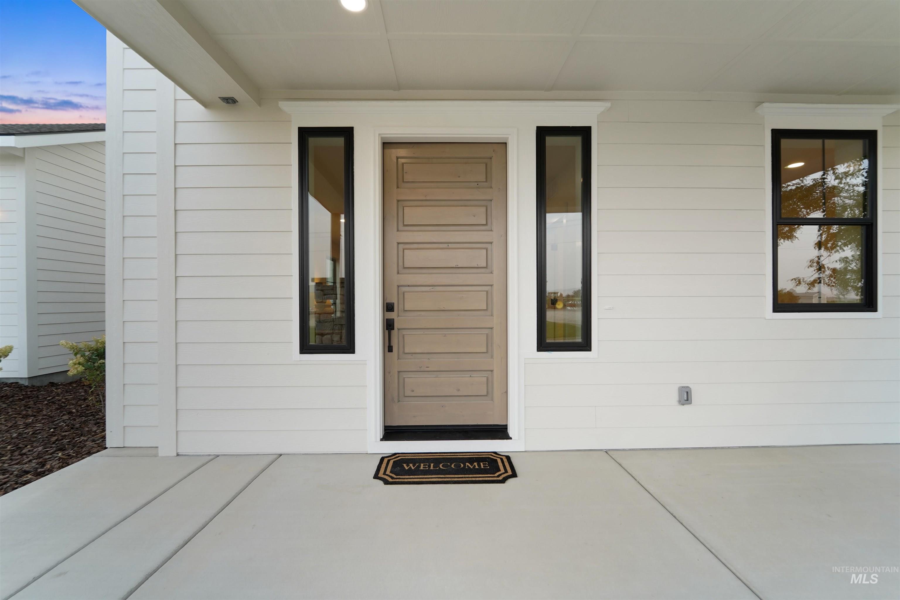 Entrance to property featuring a patio