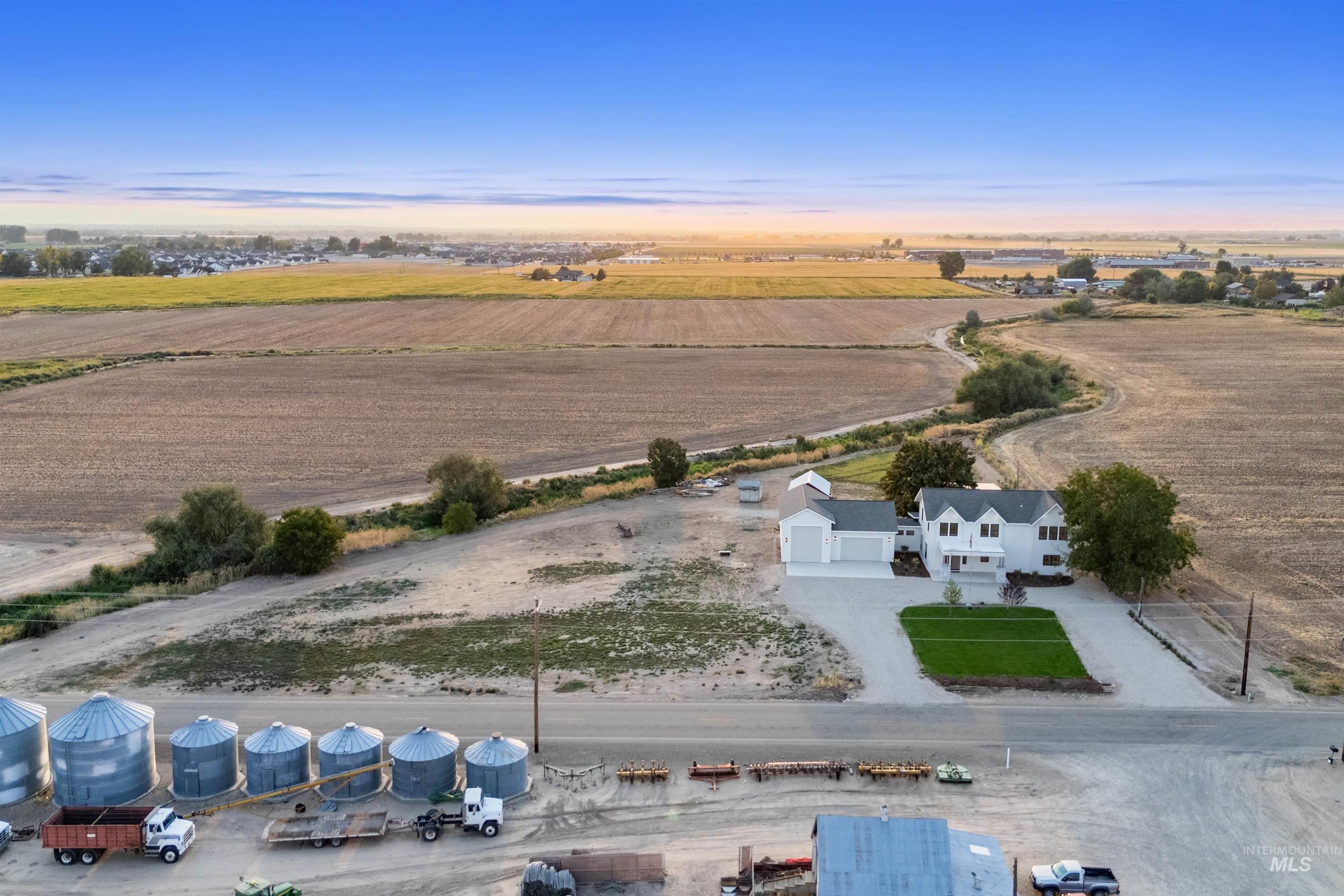 Aerial view at dusk of a view of rural / pastoral area and agricultural plots