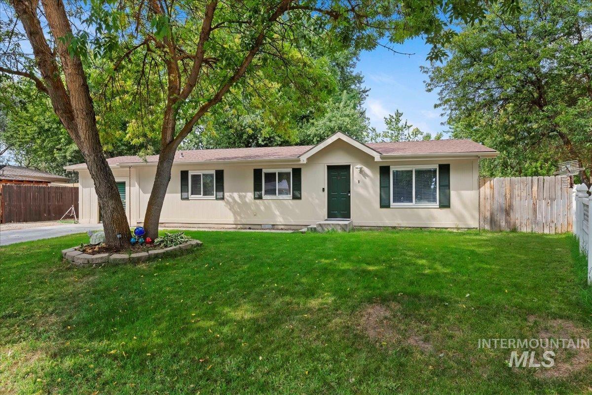 Single story home featuring stucco siding
