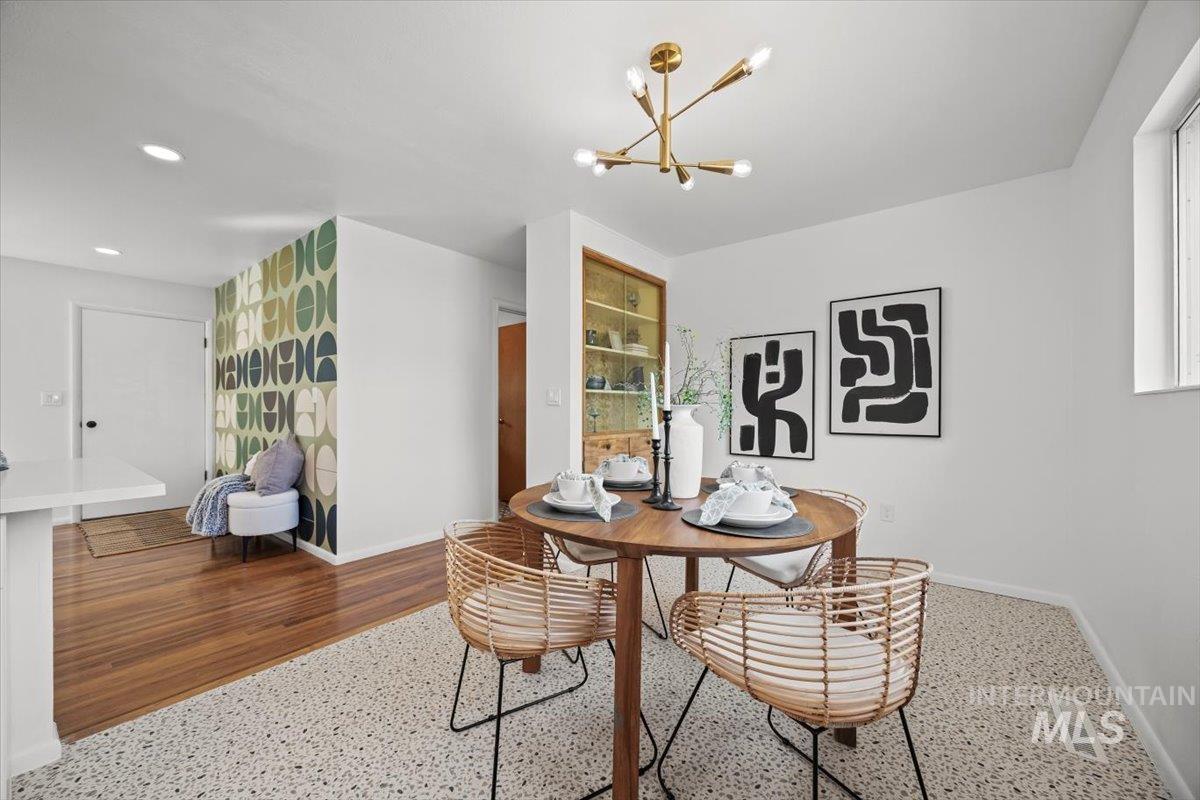 Dining room featuring a chandelier and recessed lighting