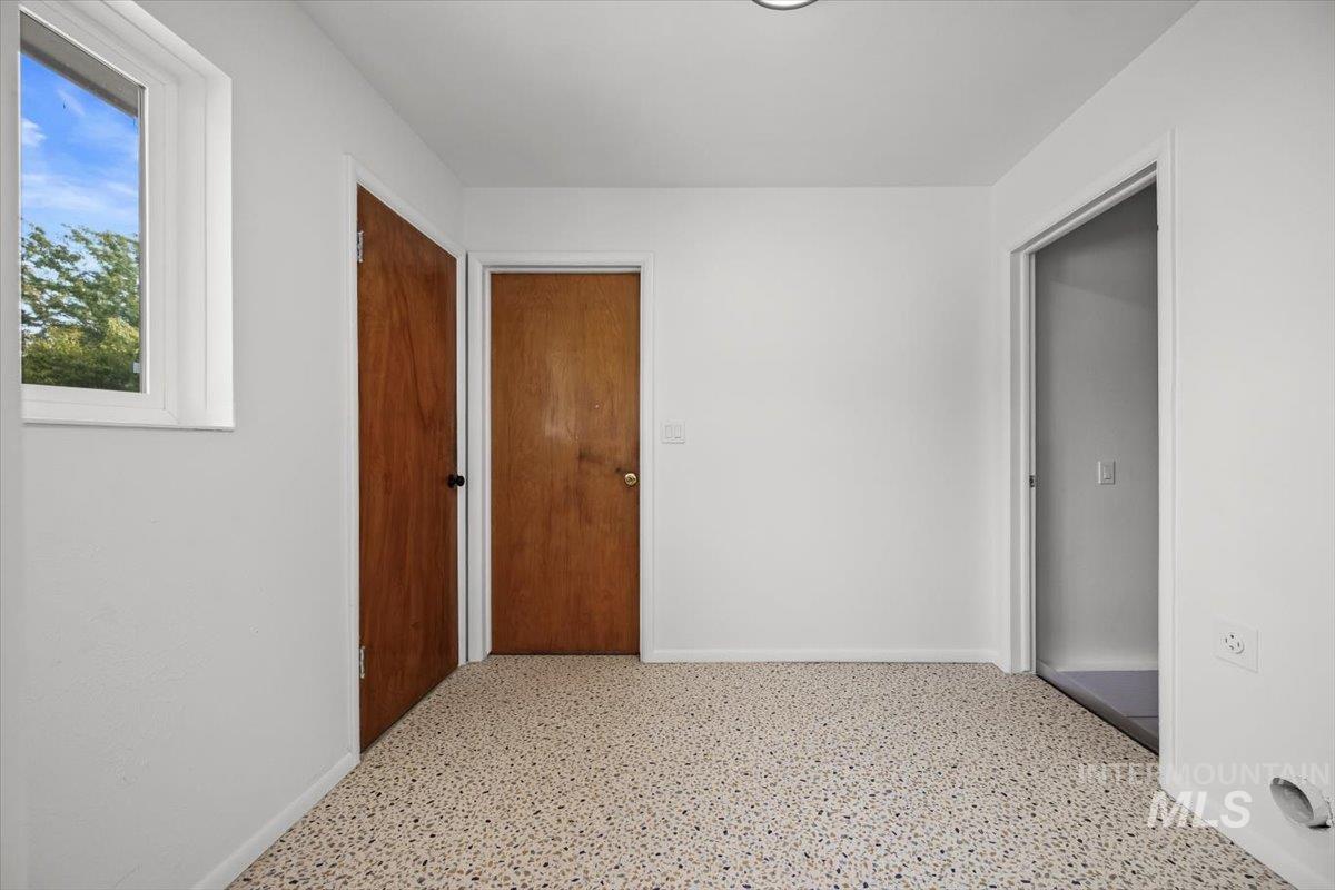 Corridor featuring baseboards