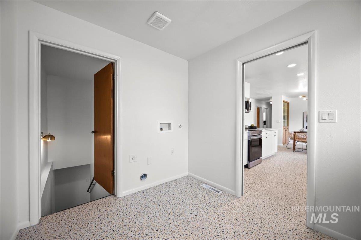 Hallway featuring baseboards and recessed lighting