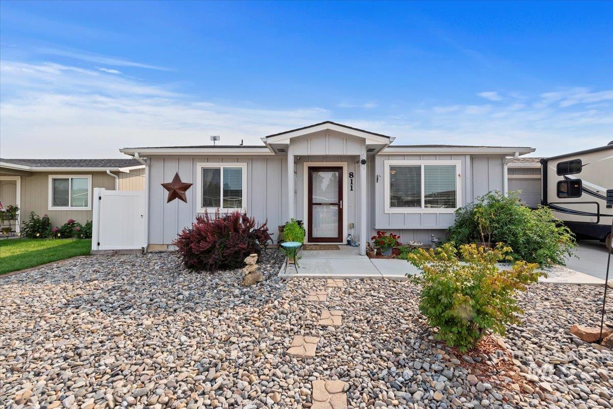 Ranch-style house with board and batten siding