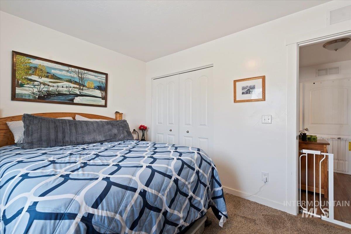Bedroom featuring carpet floors and a closet