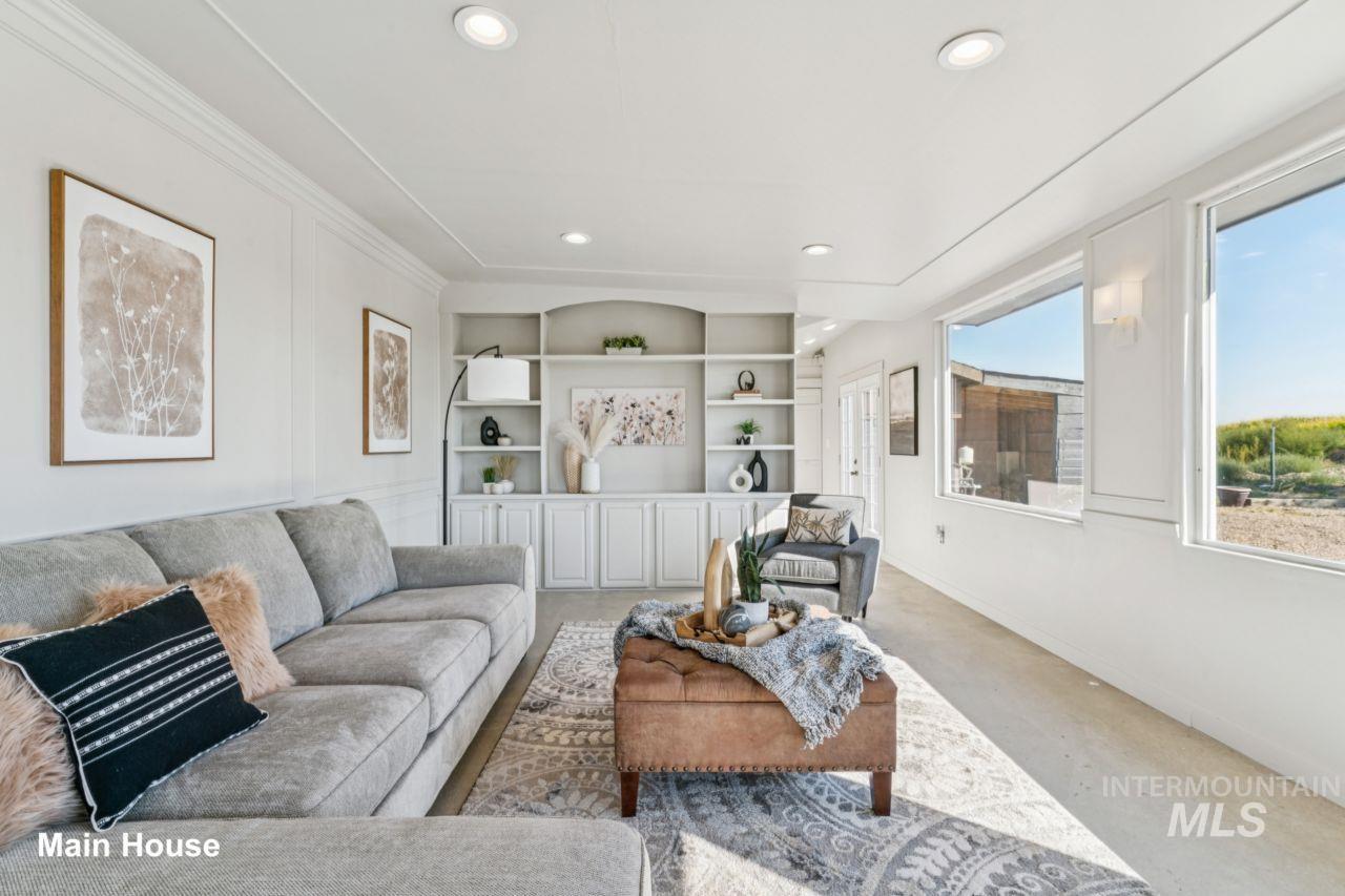 Living room with recessed lighting and built in shelves