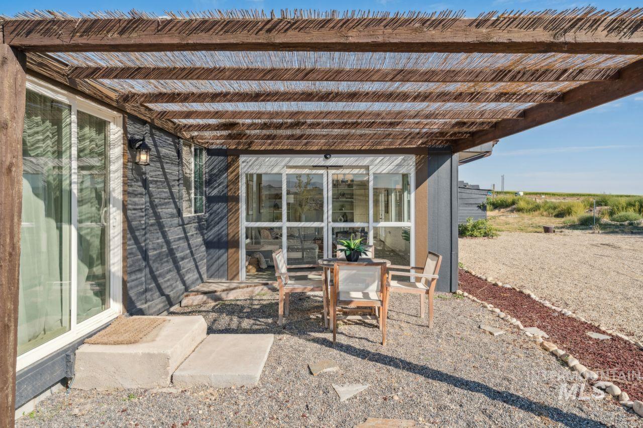 View of patio / terrace with outdoor dining space and a pergola