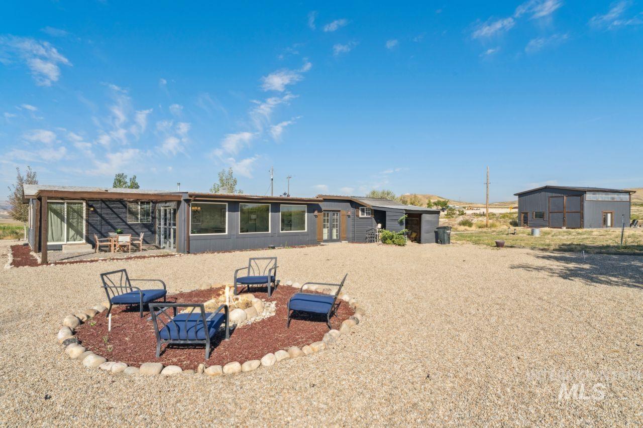 Rear view of house featuring a patio