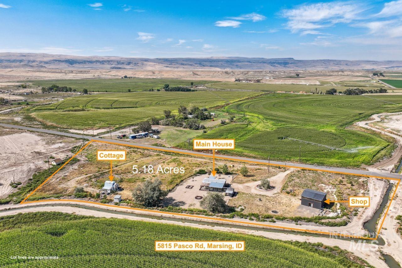 Aerial overview of property's location with property boundaries highlighted and rural landscape