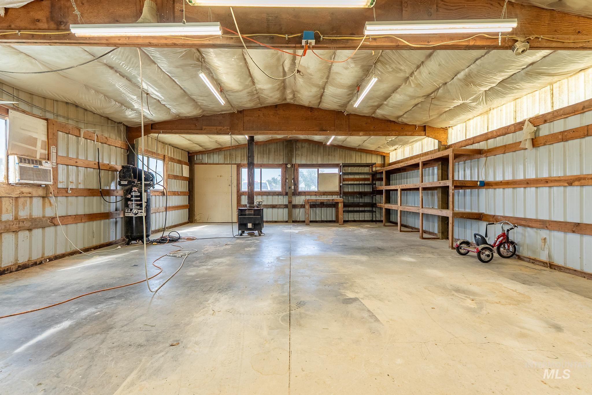 Garage featuring metal wall
