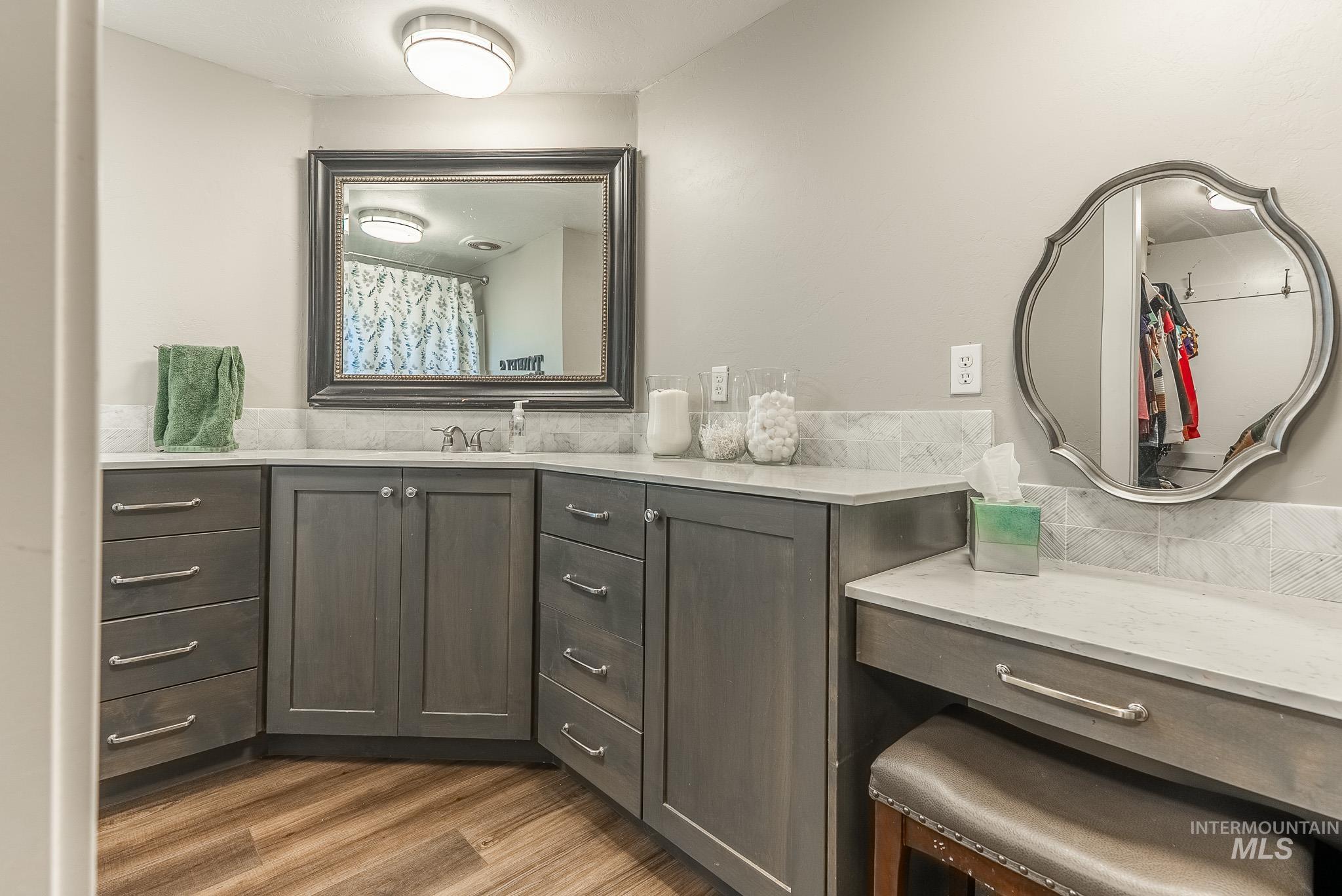 Bathroom with vanity and light wood-type flooring