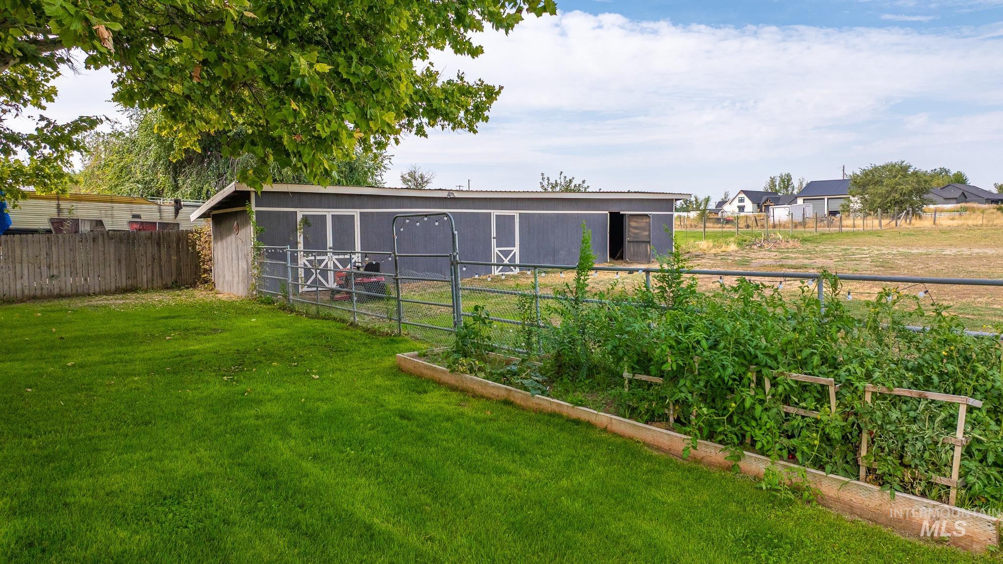 Rear view of house with an outdoor structure