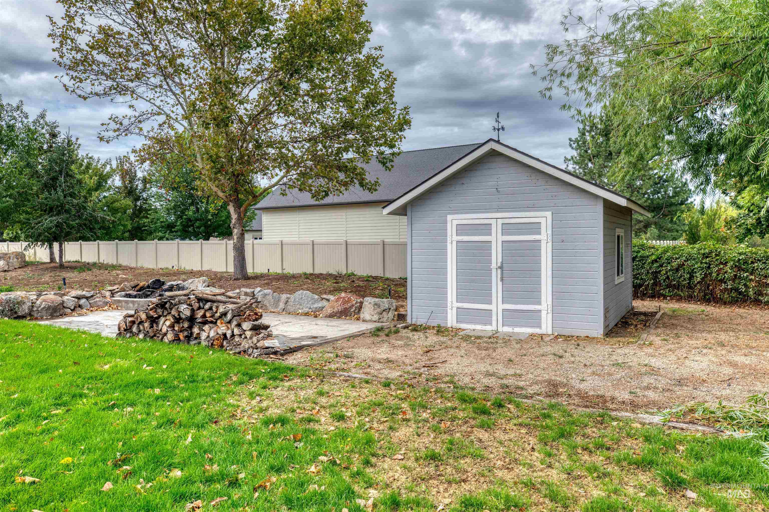 View of shed with a fenced backyard