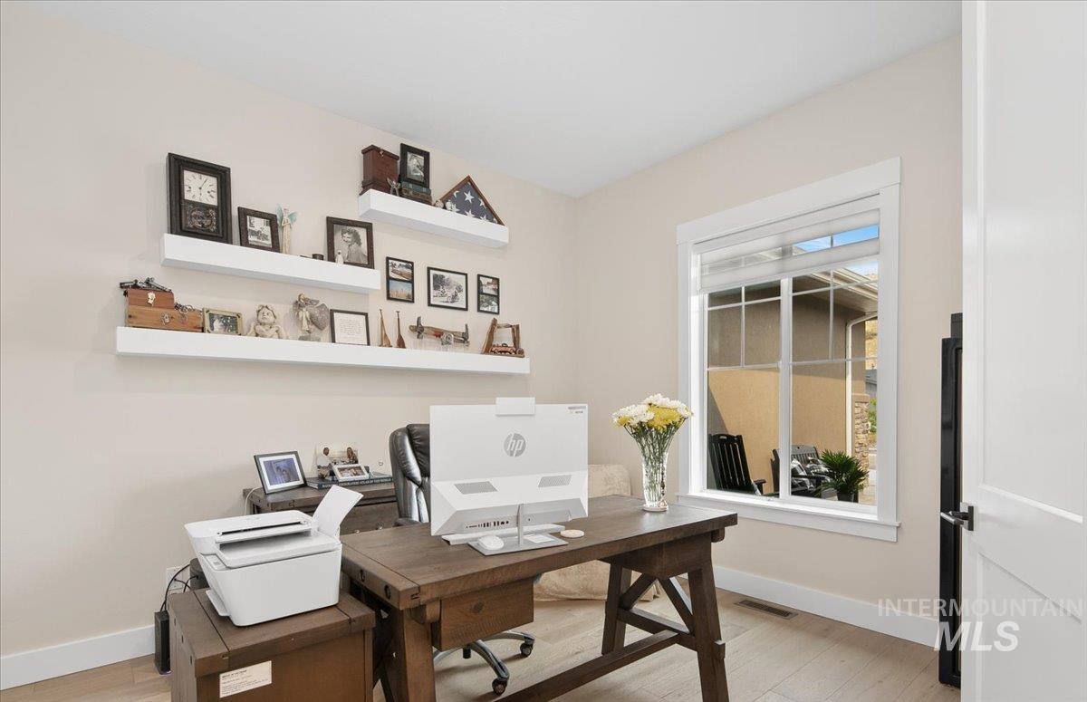 Office area featuring light wood-style flooring