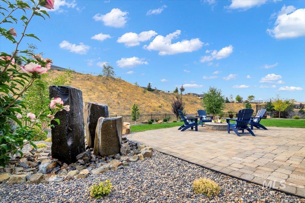 View of patio with a fire pit